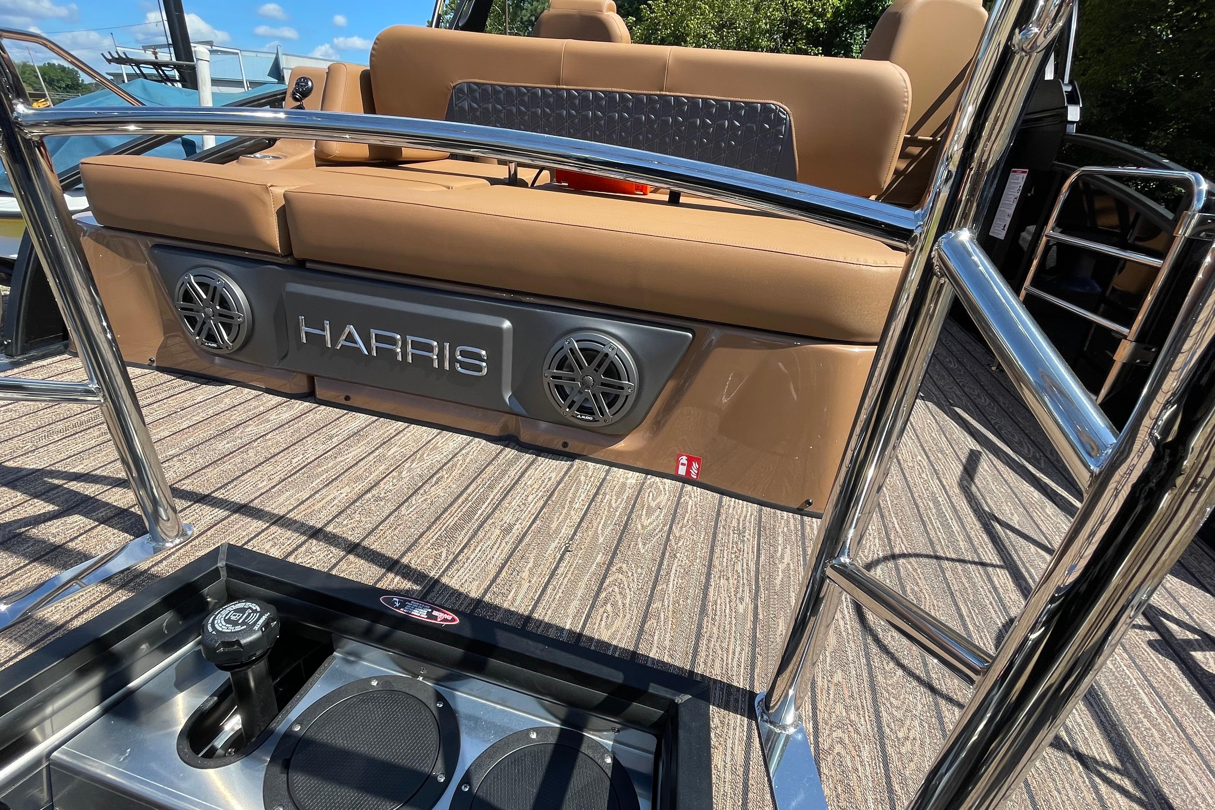 2026 Harris Solstice 250 SLDH boat interior with brown seating and stainless steel accents.