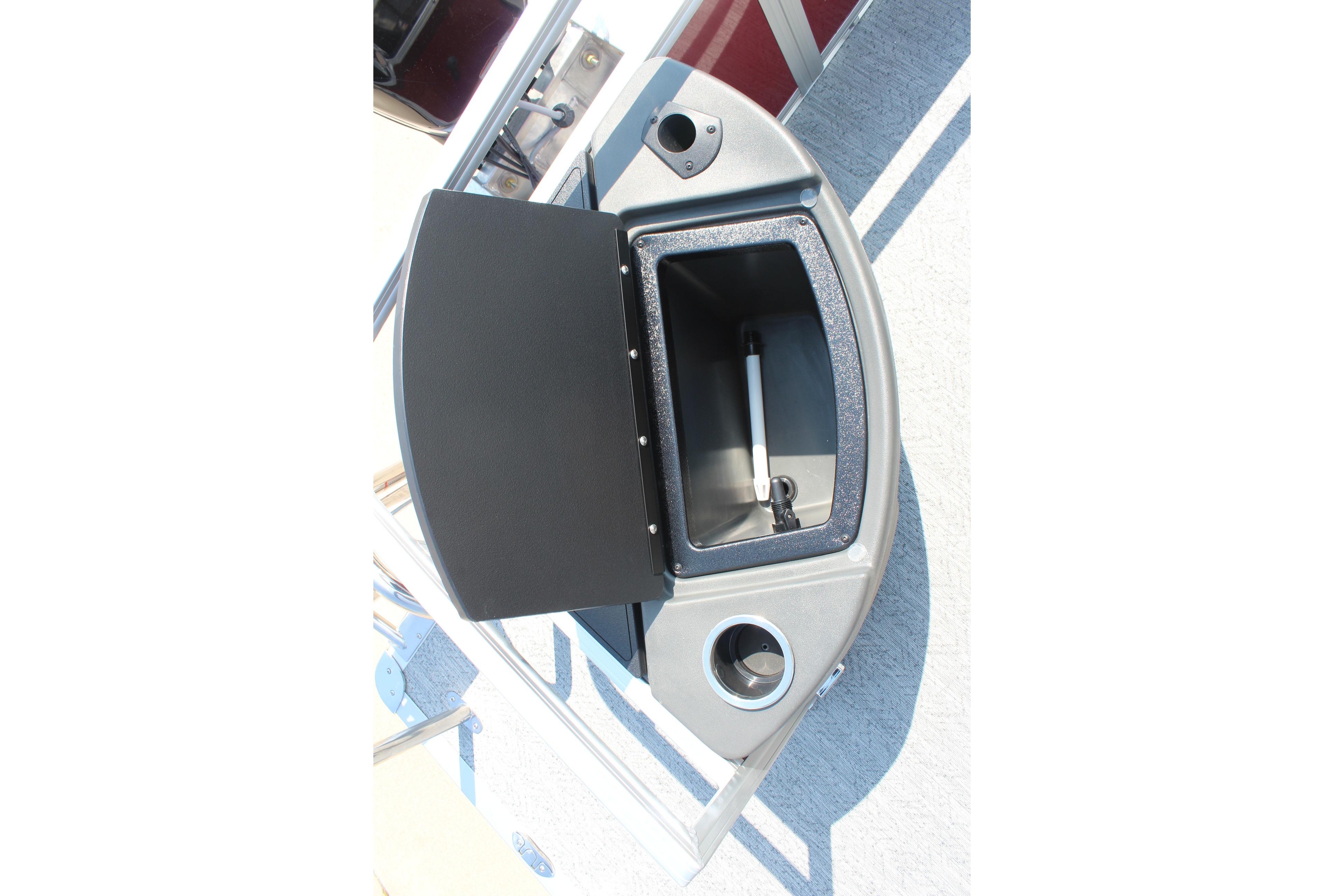 2026 Sun Tracker Bass Buggy 18 DLX storage compartment with open lid and cup holder.