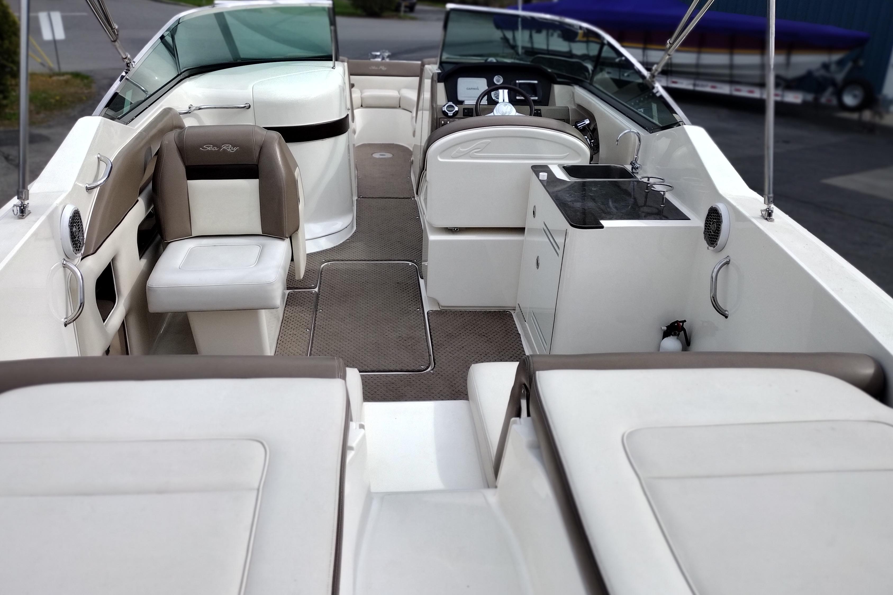 2013 Sea Ray 300 SLX boat interior with seating, helm, and kitchenette.