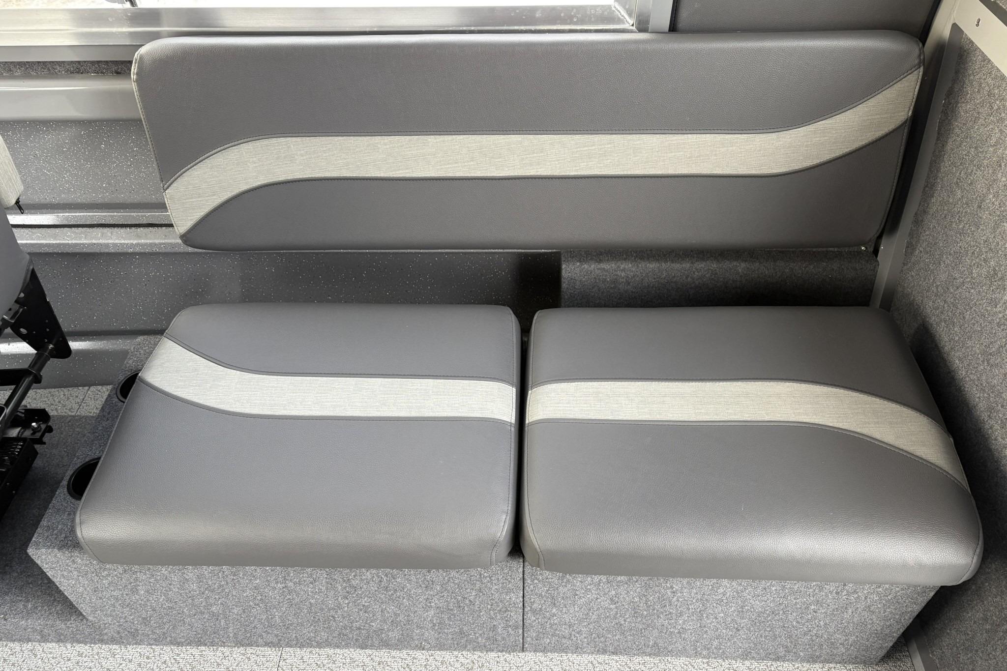 2024 Spartan 26 Maximus Pro XL interior seating with gray upholstery and modern design.