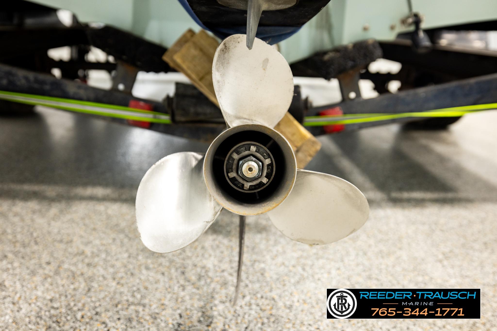 Propeller of a 1980 Ranger 175 VS boat in a garage setting.