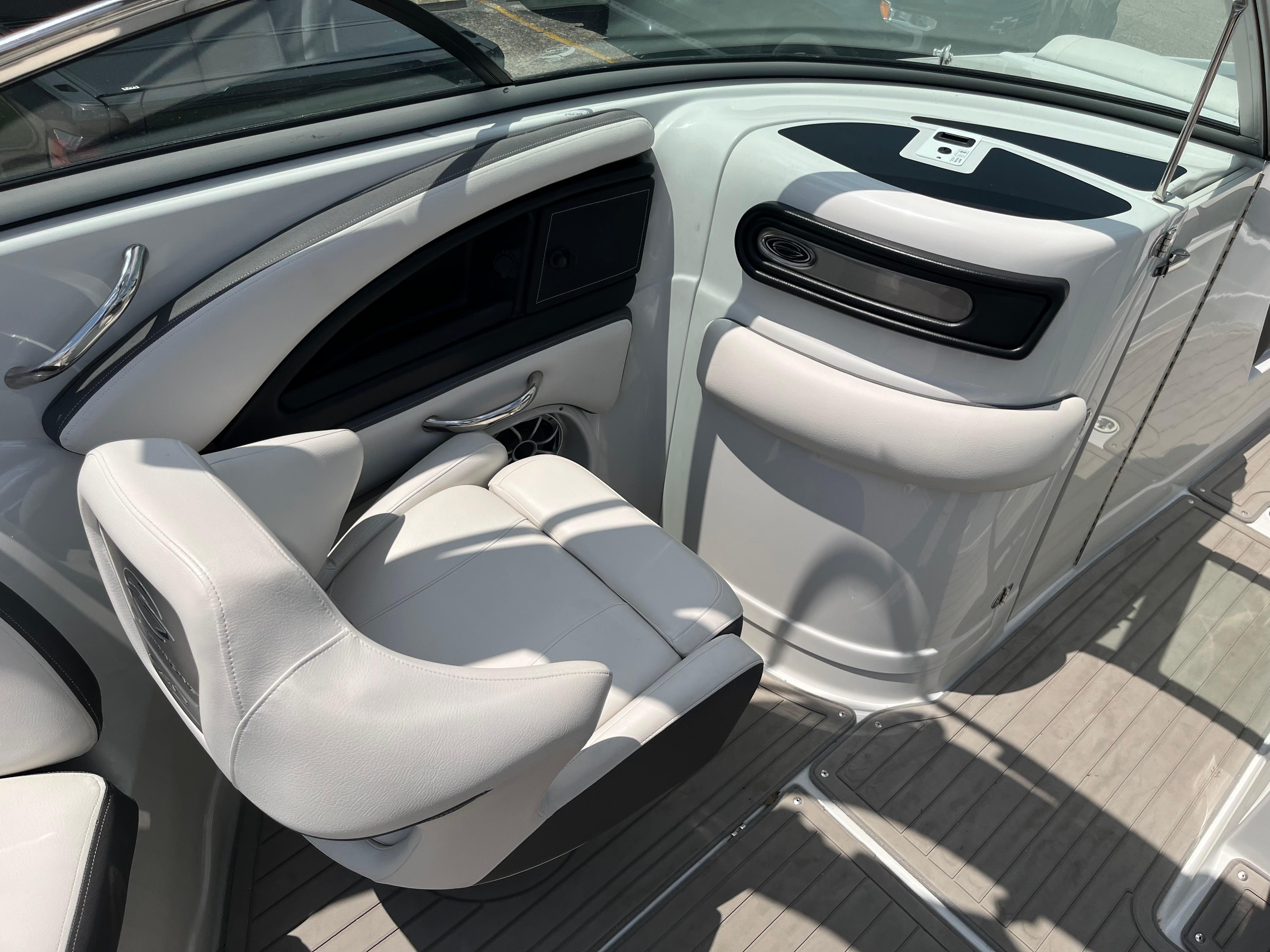 2022 Crownline 280 SS boat interior with white seating and sleek dashboard design.