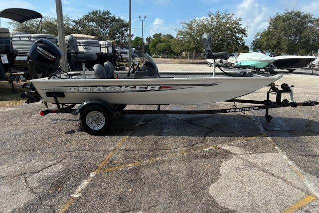 2026 Tracker Pro 170 boat on trailer in parking lot, sunny day.