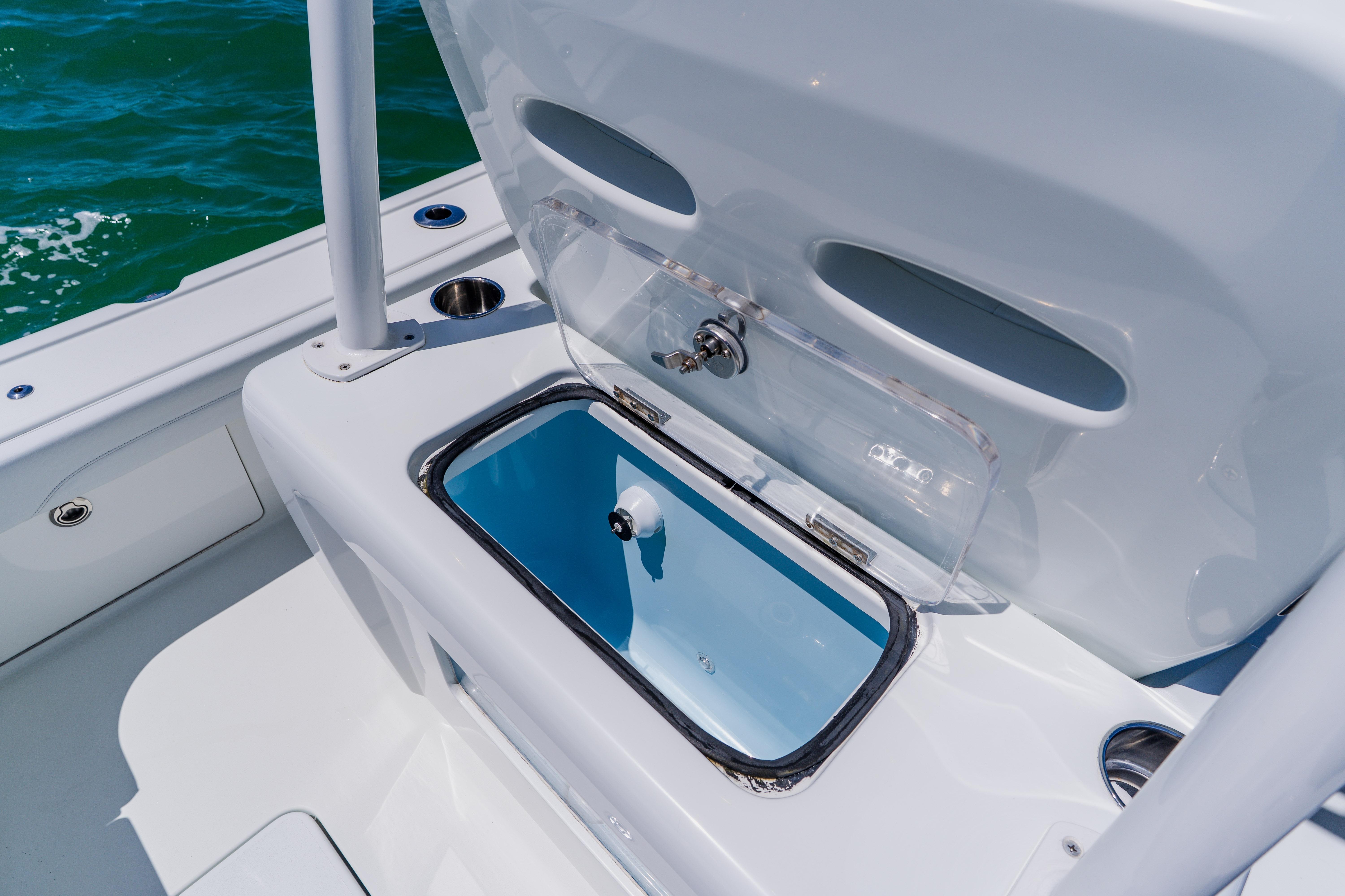 2017 Barker Boatworks 26 with open storage compartment on deck.