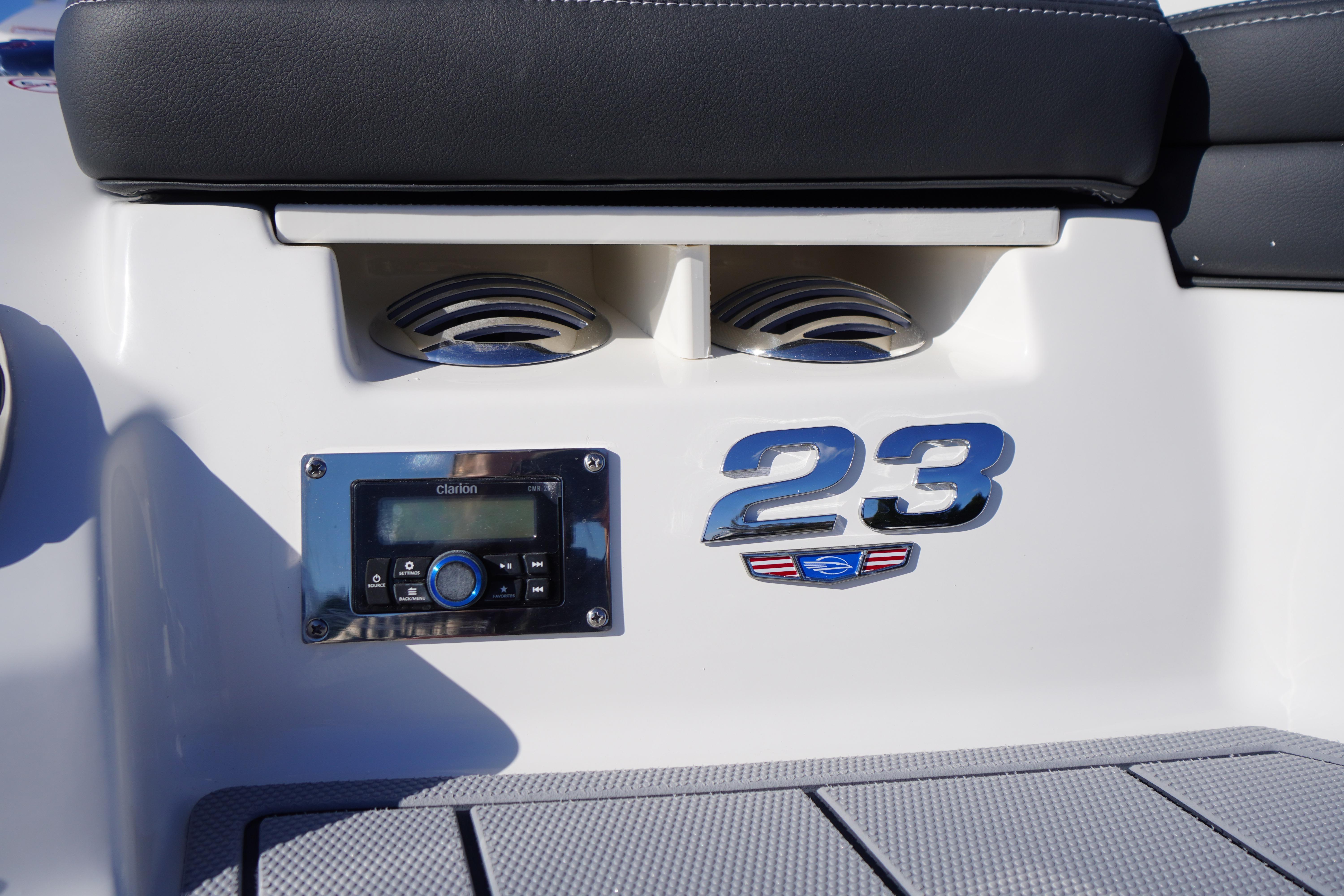 2026 Chaparral 23 SSi boat interior with audio system and model emblem.