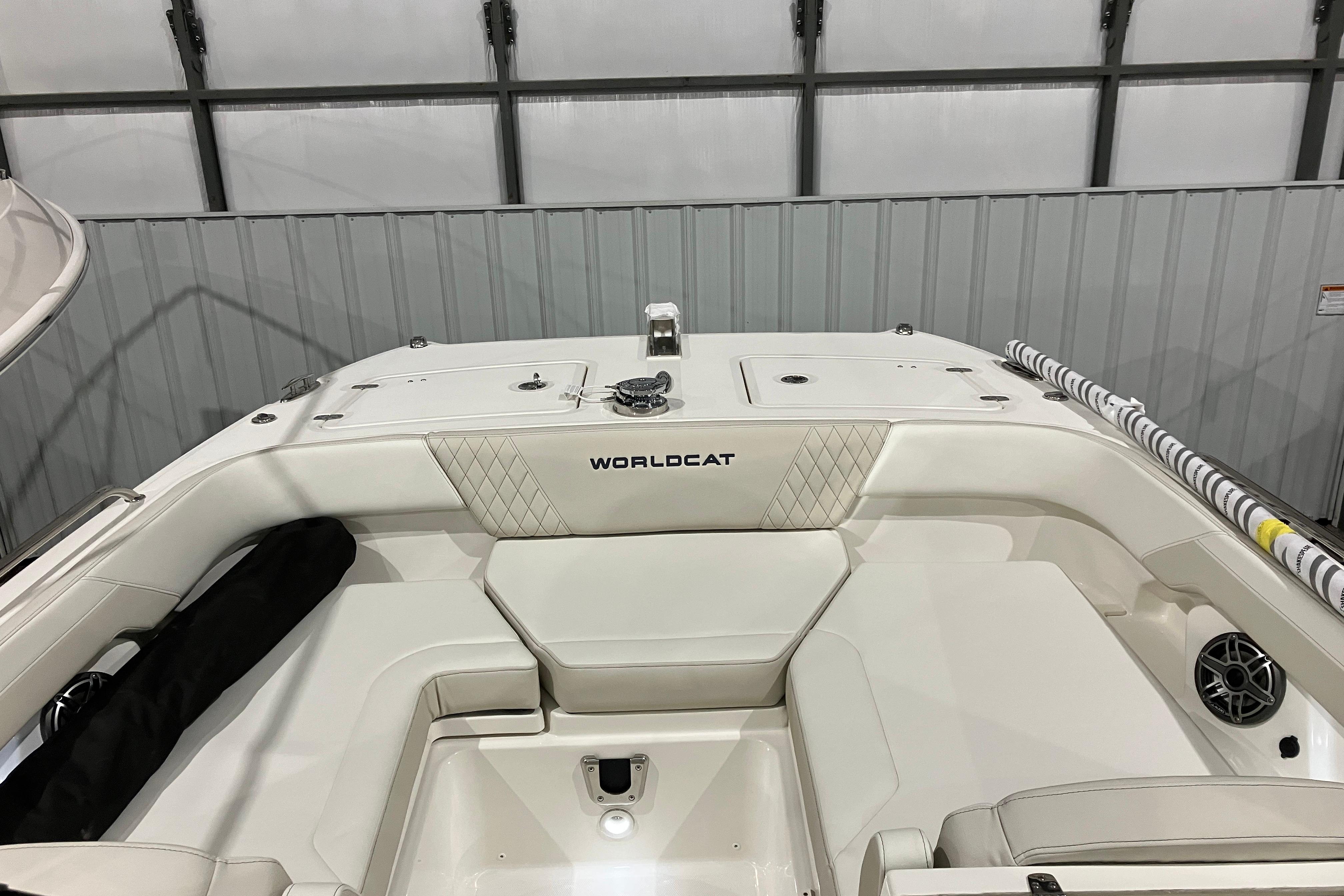2026 World Cat 265 DC-X boat interior with white seating and diamond stitching.