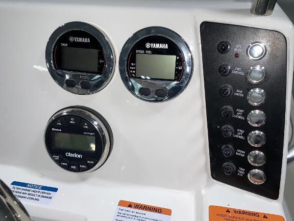 Dashboard of 2026 Robalo 226 Cayman with Yamaha gauges and Clarion audio system.