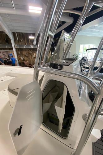 2024 Key West 250 Bay Reef boat interior with open storage compartment.