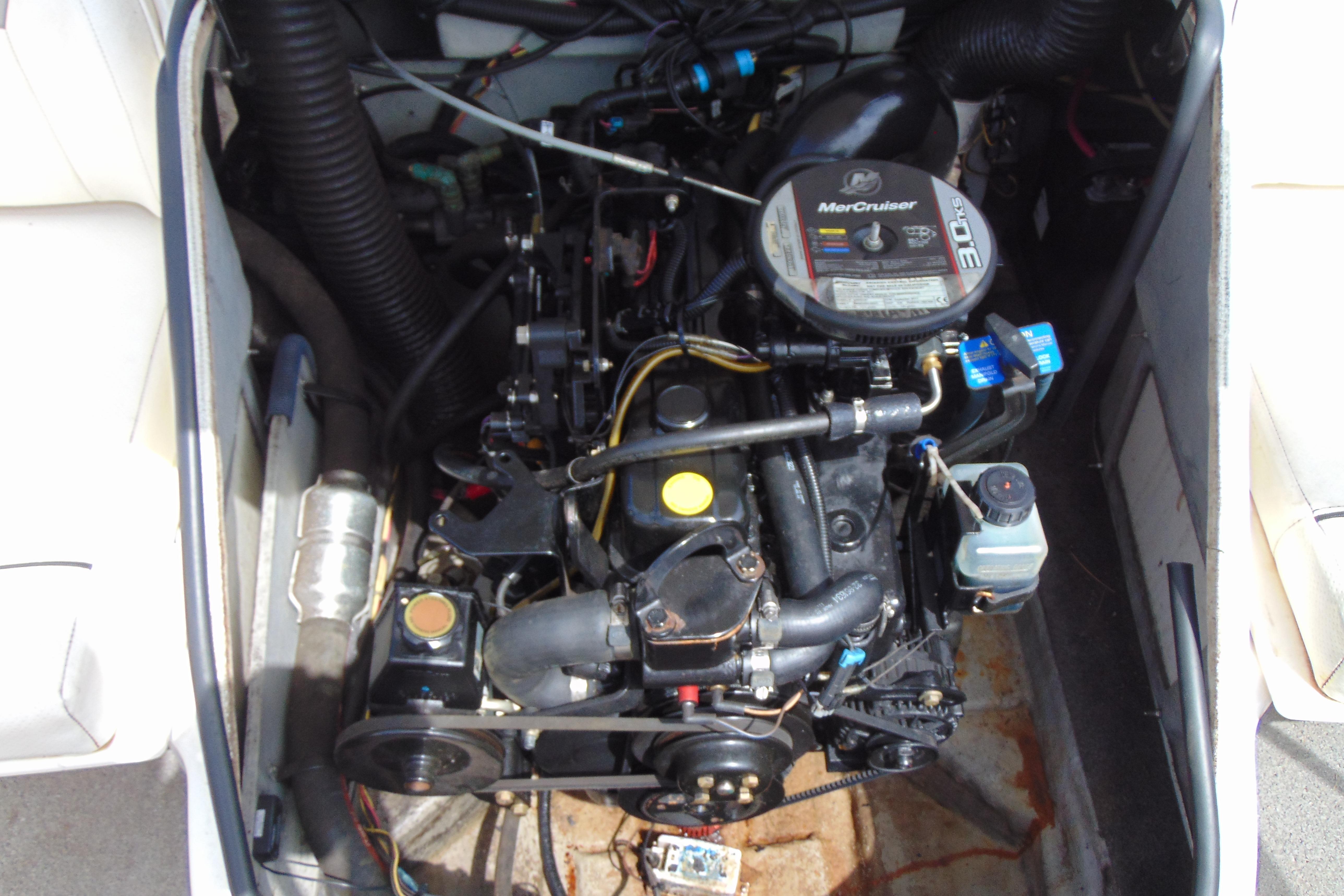 Engine compartment of a 2012 Bayliner 185 Bowrider with MerCruiser 3.0L motor.