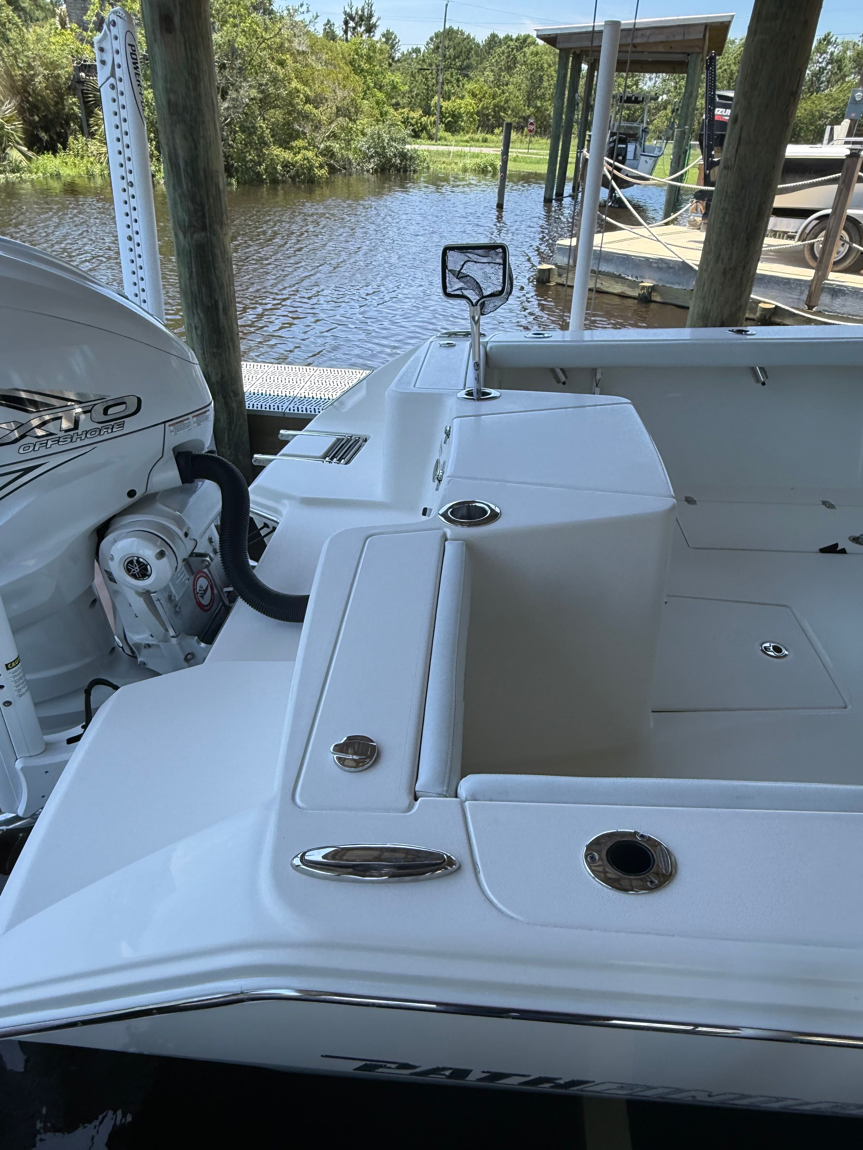 2024 Pathfinder 2700 Open at dock, engine and deck visible.