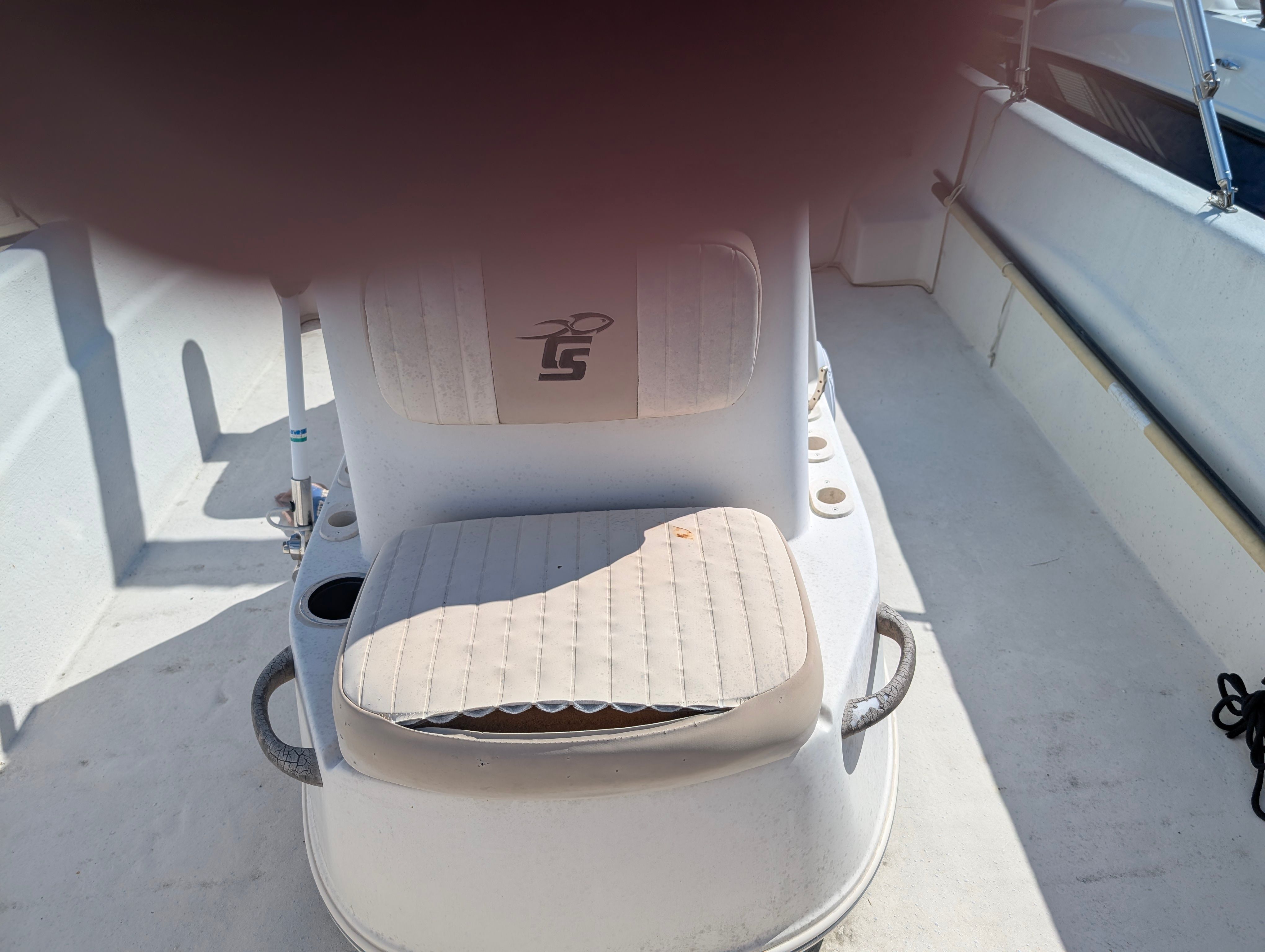 The image shows the interior of a 2016 Carolina Skiff 198 DLV with a cushioned seat.