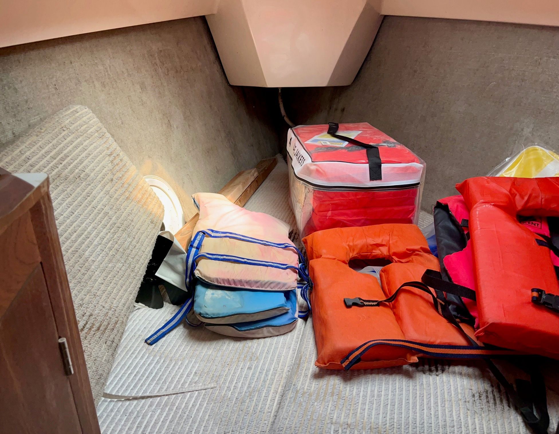 Interior of a 1985 Hunter 30 with life jackets and cushions.