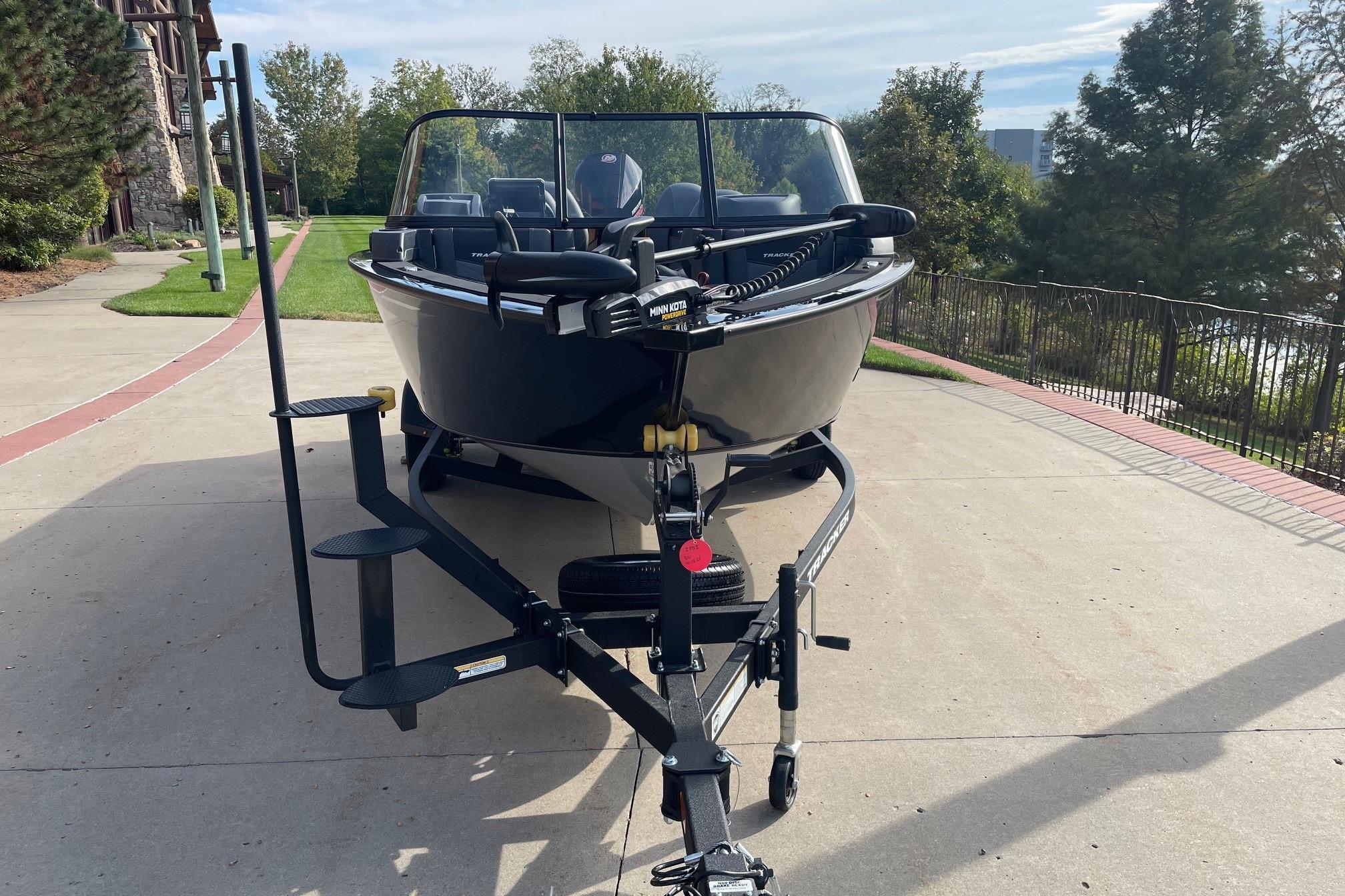 2026 Tracker Targa V-18 WT boat on trailer, parked on a driveway.