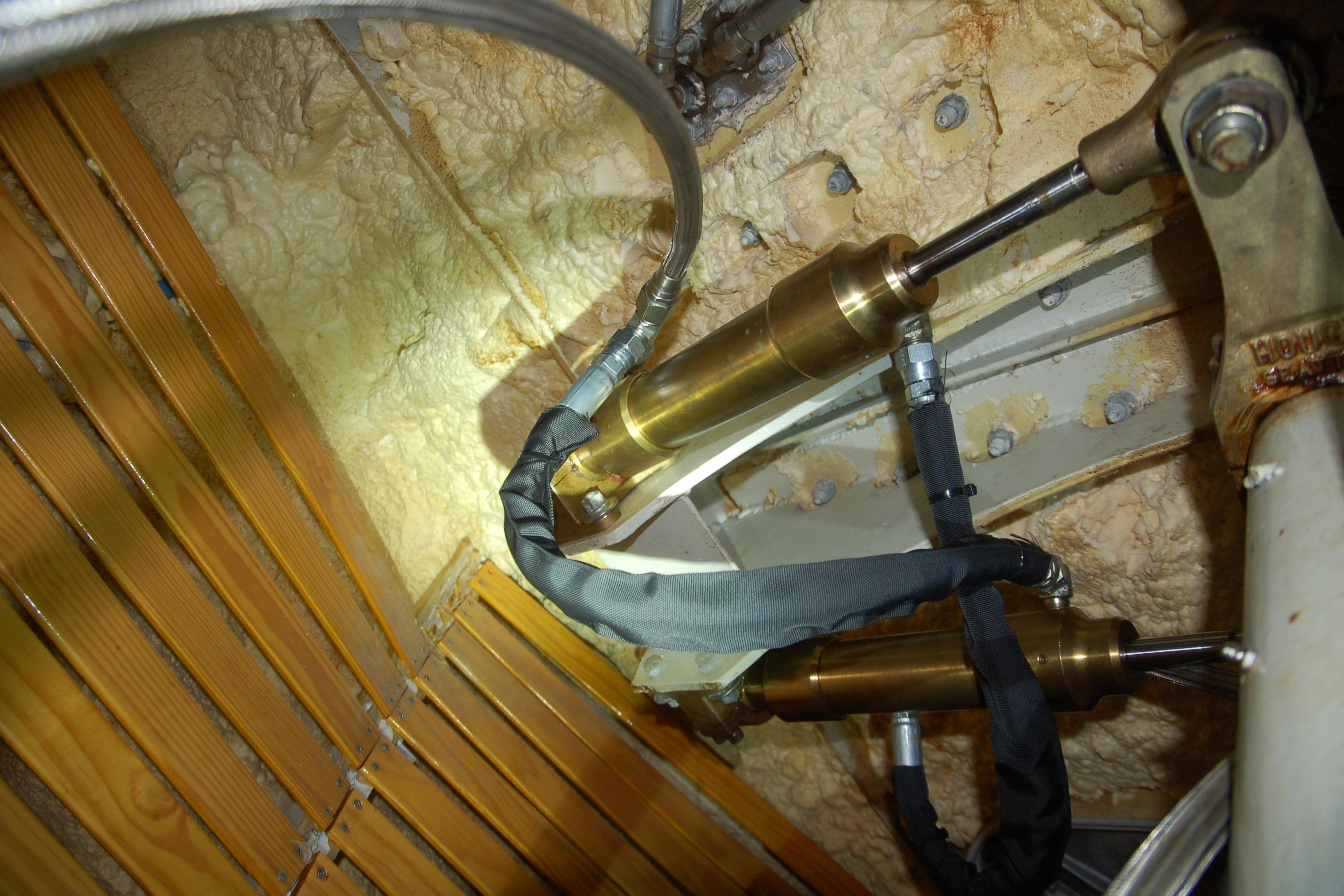 Hydraulic components in a Custom Sprague 2006 model, featuring insulated pipes and foam insulation.