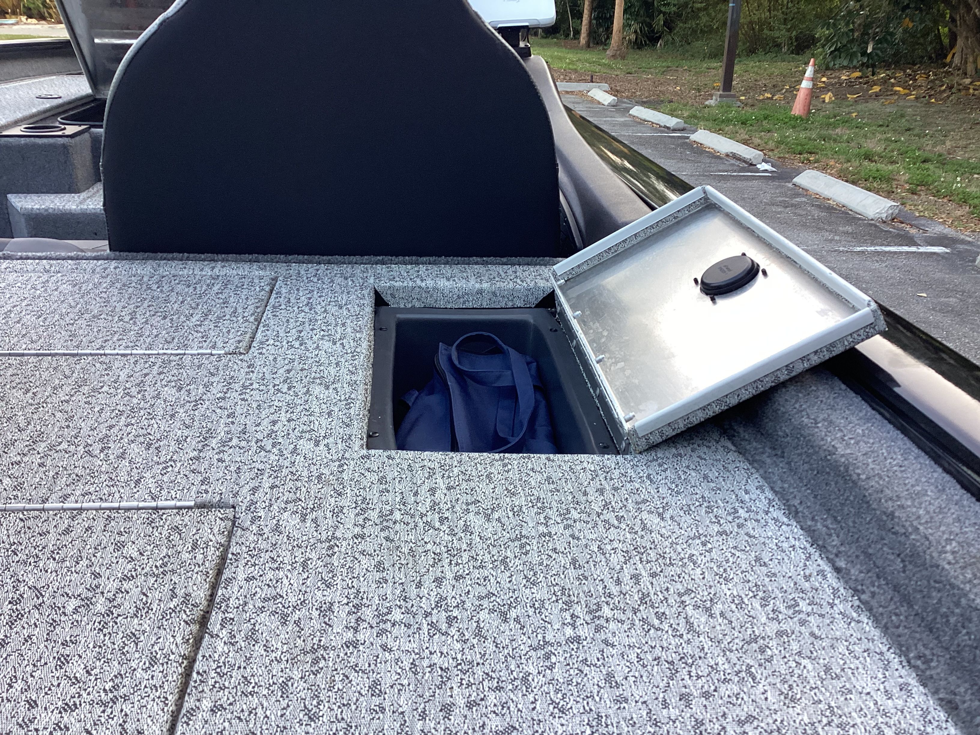 Tracker PRO 2023 boat with open storage compartment.