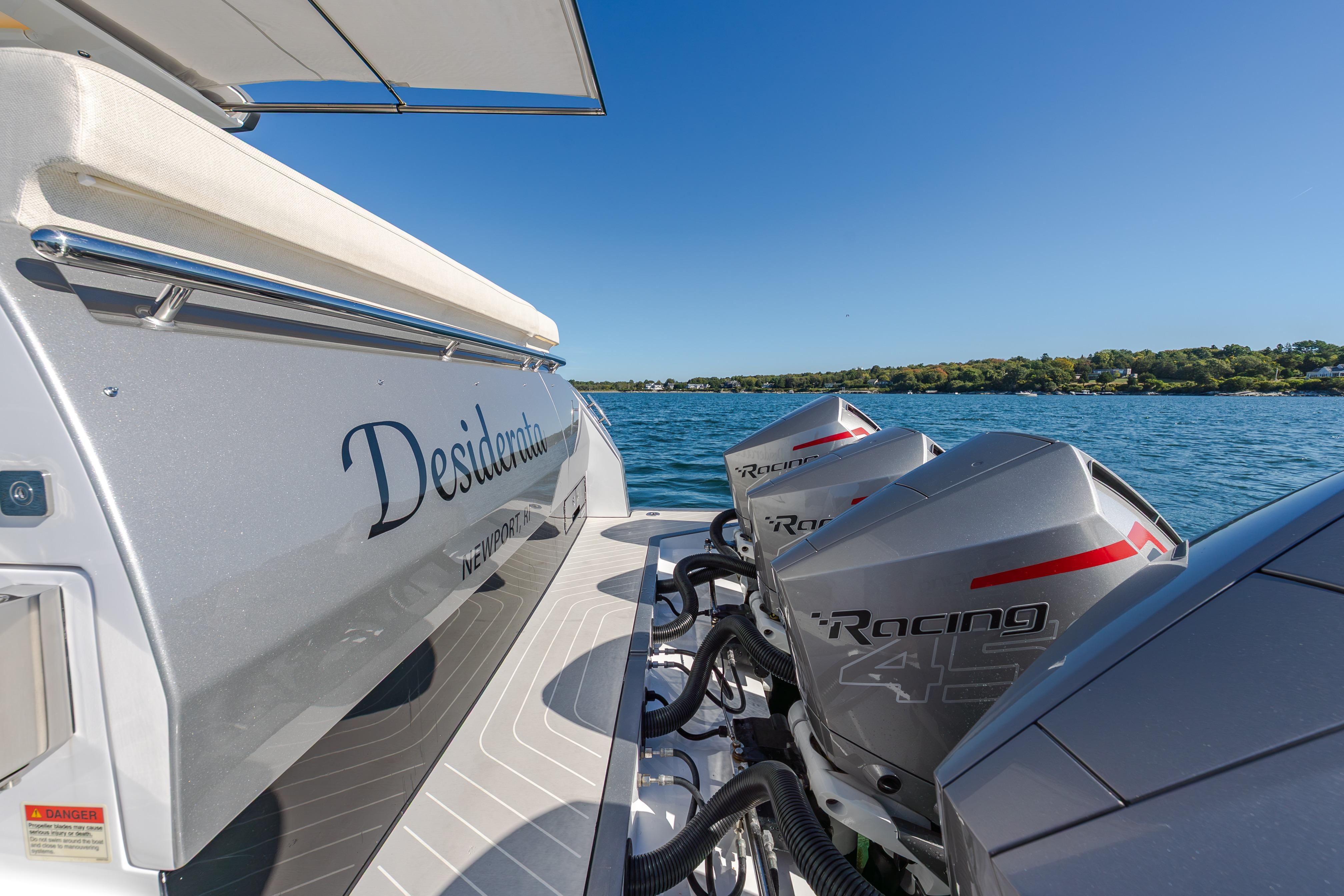 Azimut Verve 47 yacht with powerful outboard engines on a sunny day, 2023 model.