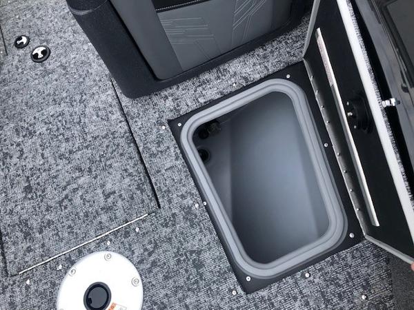 2025 Tracker Targa V18 Combo boat interior with open storage compartment.