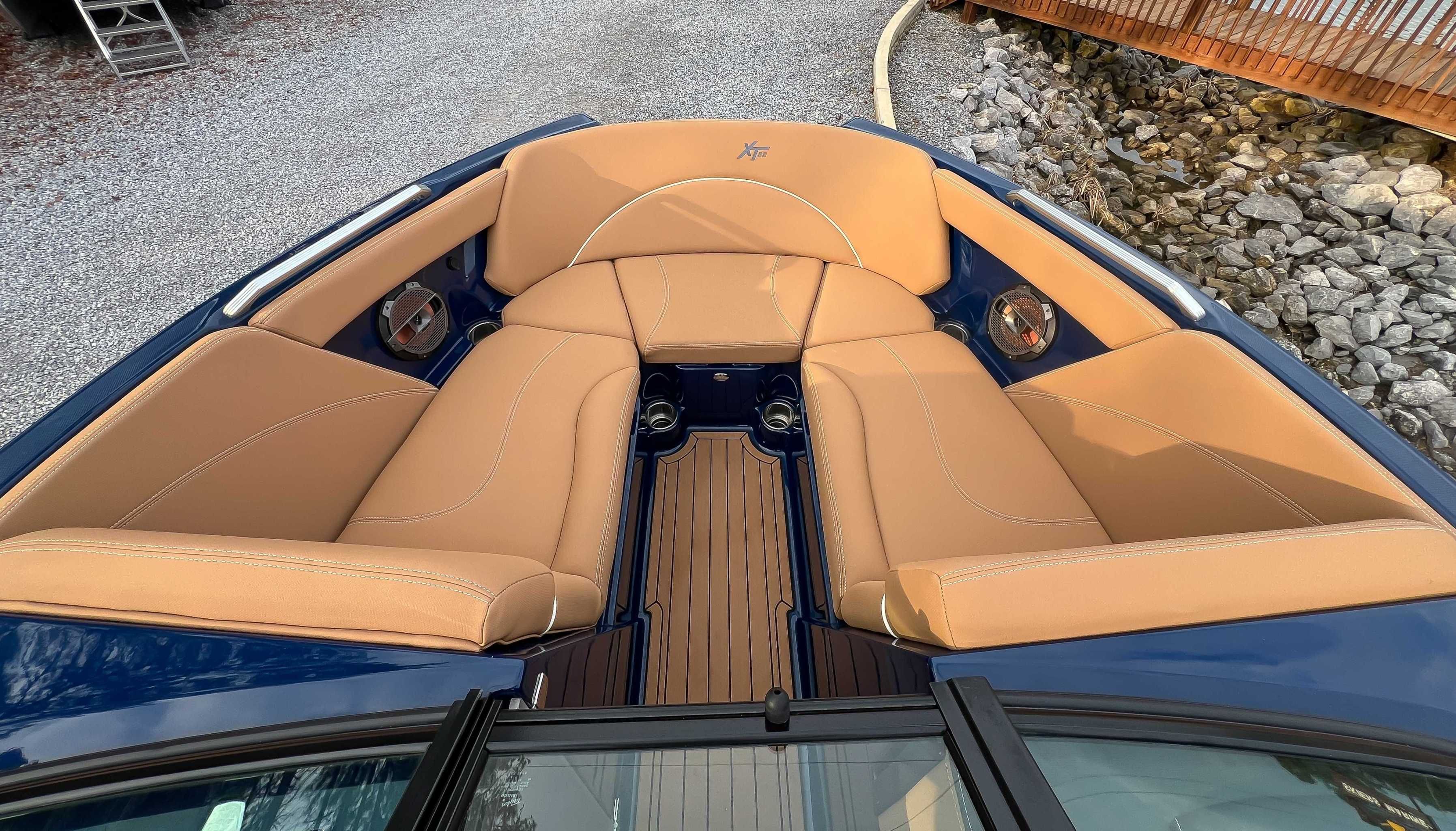 Interior of a 2021 MasterCraft XT22 boat with beige seating.
