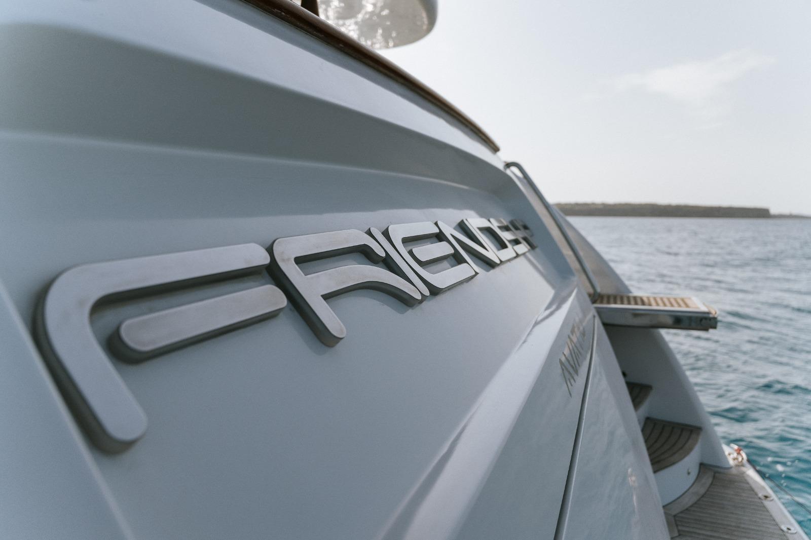 Benetti Classic 115 yacht, 2000 model, with "Friend" nameplate, docked by the sea.
