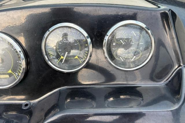 Dashboard gauges of a 2017 Searay SPX210 boat, featuring speedometer and fuel indicators.