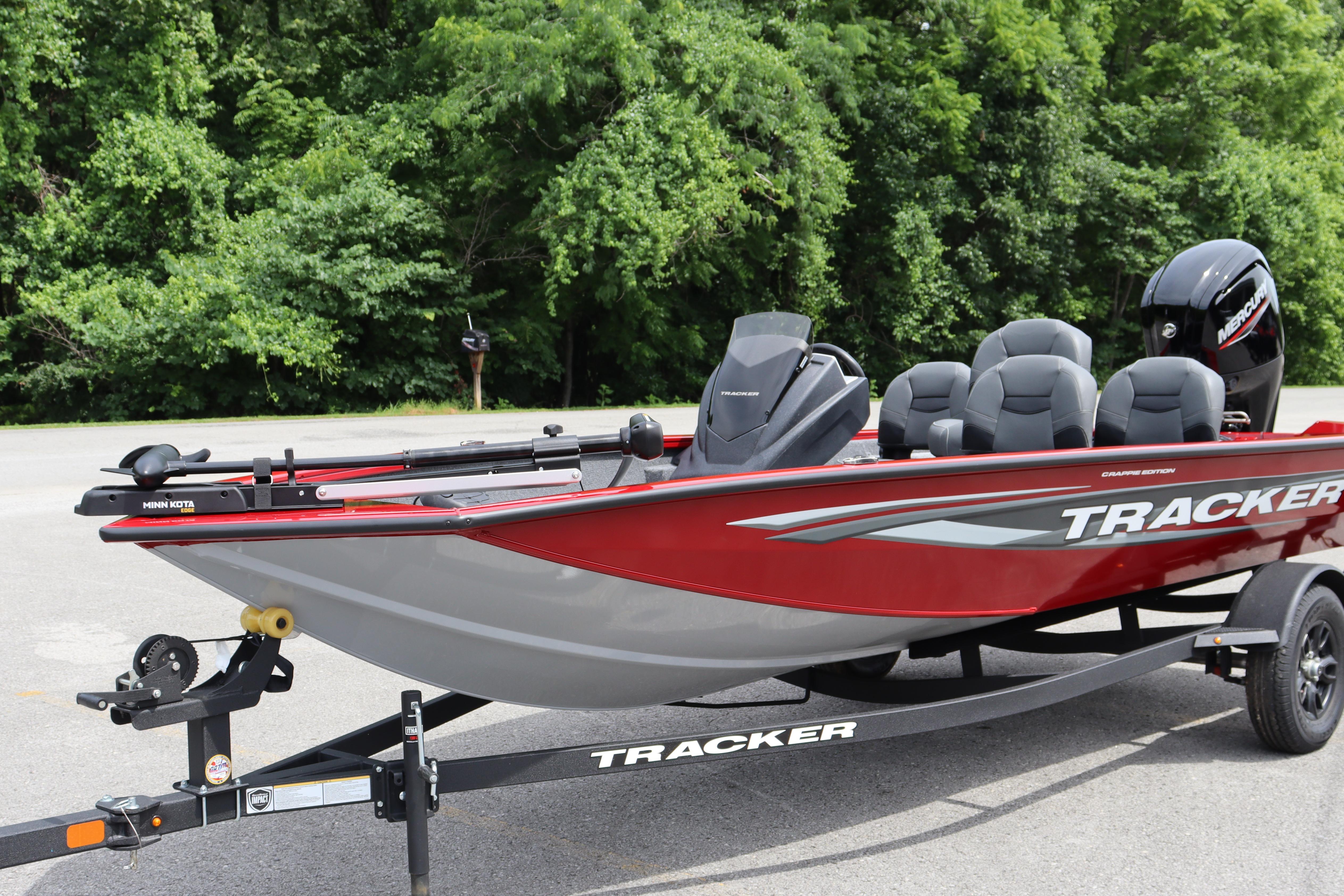 2026 Tracker Pro Team 175 Crappie Edition boat, red and gray, parked on trailer.