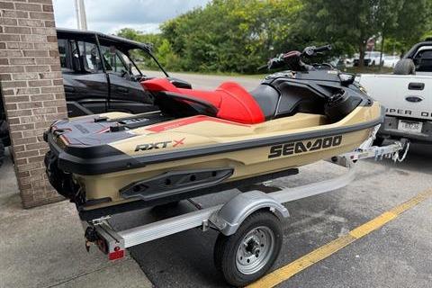 2025 Sea-Doo RXT-X 325 jet ski on trailer, parked outdoors.