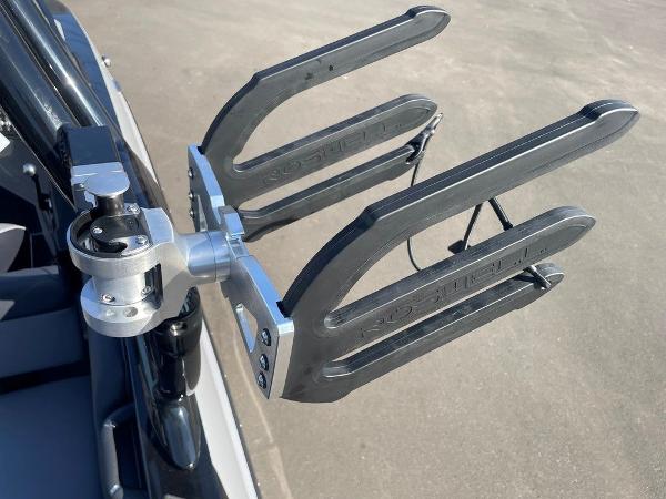 2025 Moomba Mondo boat wakeboard rack, mounted on a sleek black frame.