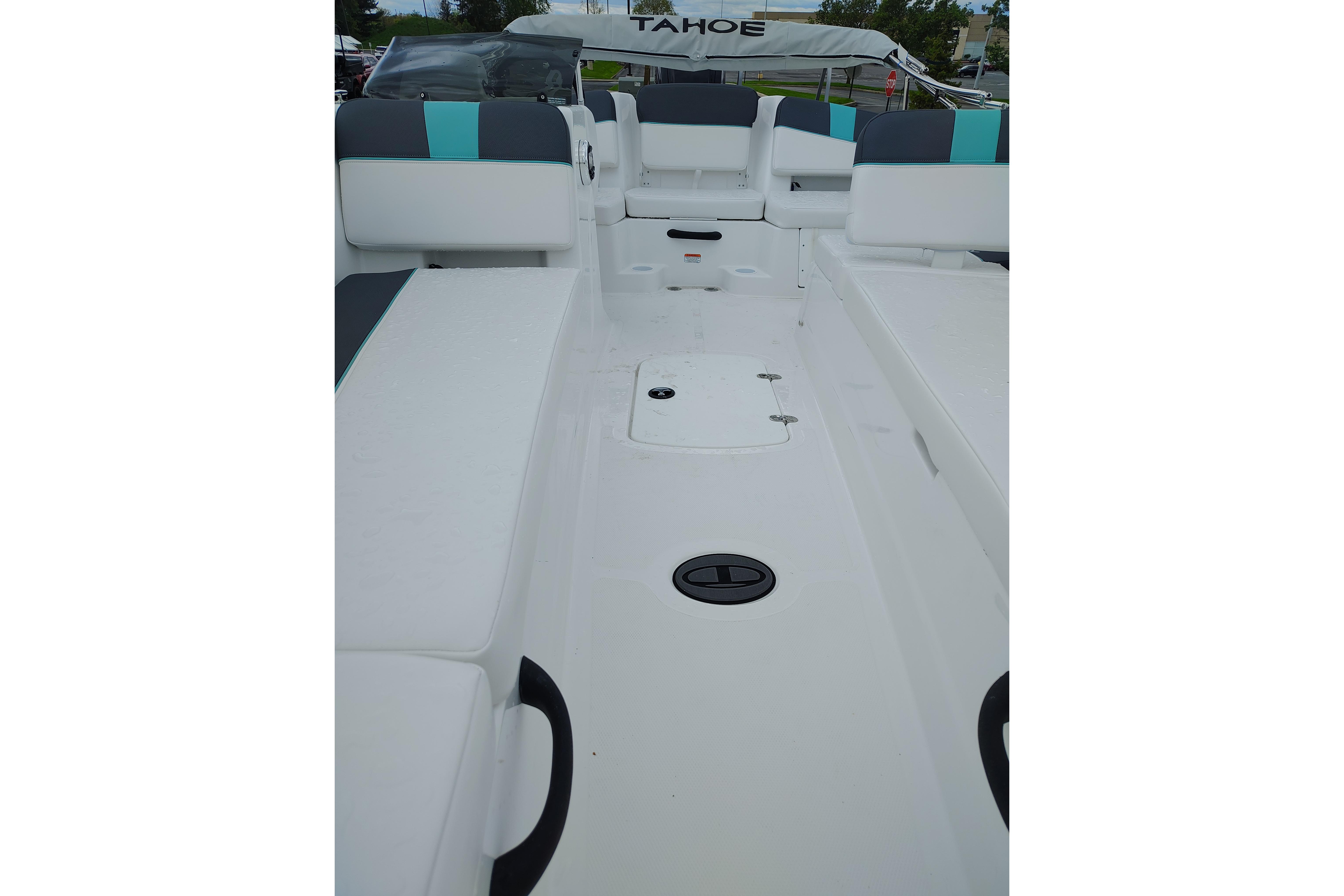 2026 Tahoe T18 boat interior with white seating and teal accents.