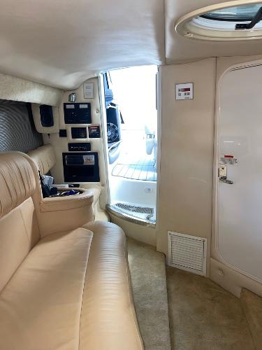 Luxurious interior of a 2005 Cobalt 343 boat with beige seating.