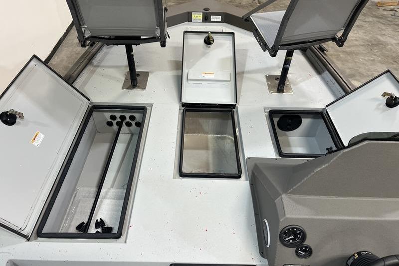 2026 SeaArk Flex 19 Pro boat interior with open storage compartments and seating.