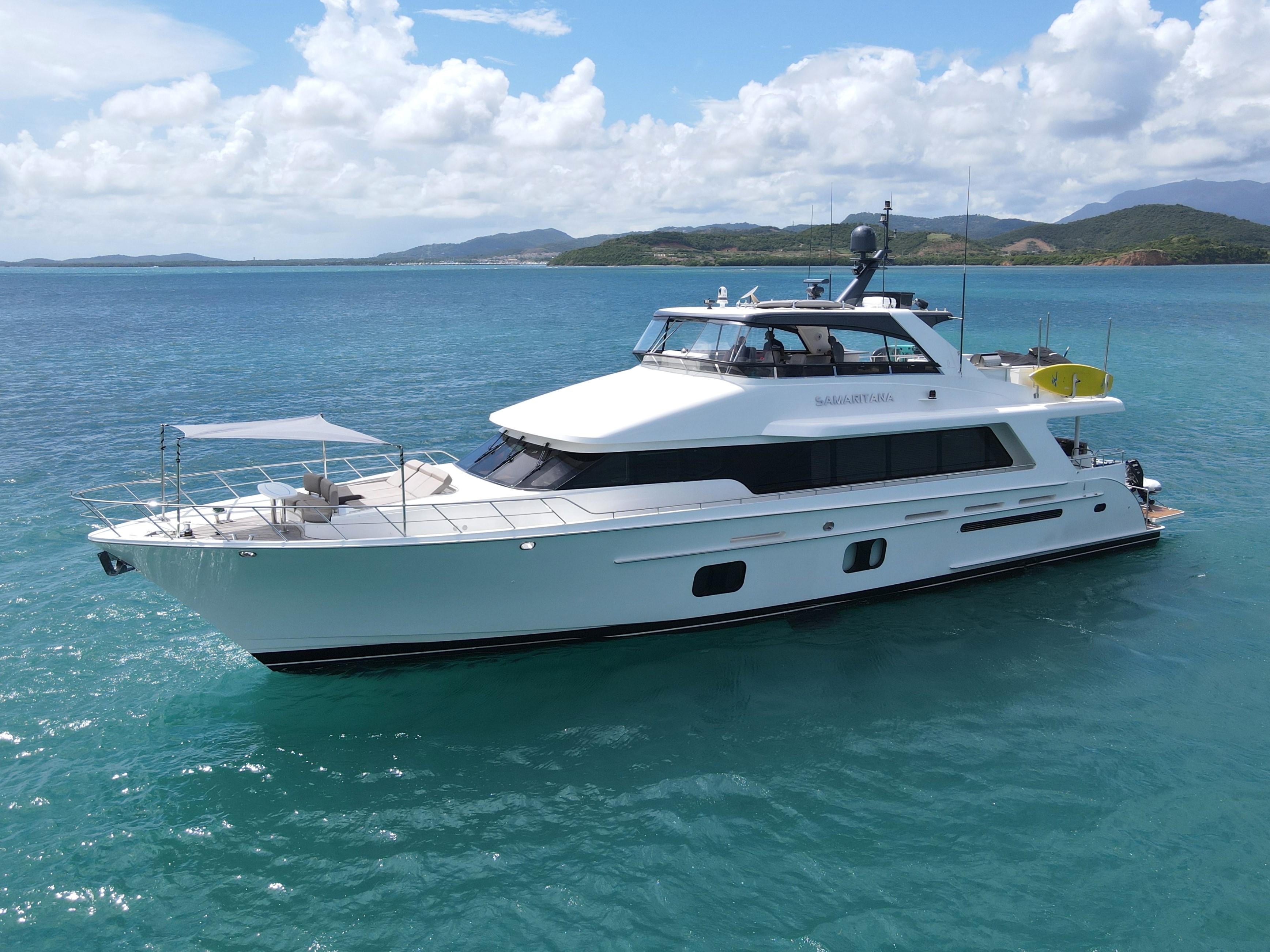Luxury 2013 Cheoy Lee Bravo yacht cruising on clear blue waters.