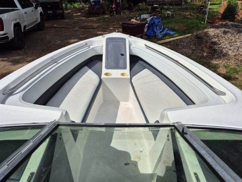 The image shows the bow area of a 1996 Cobalt 220 boat with seating and storage.