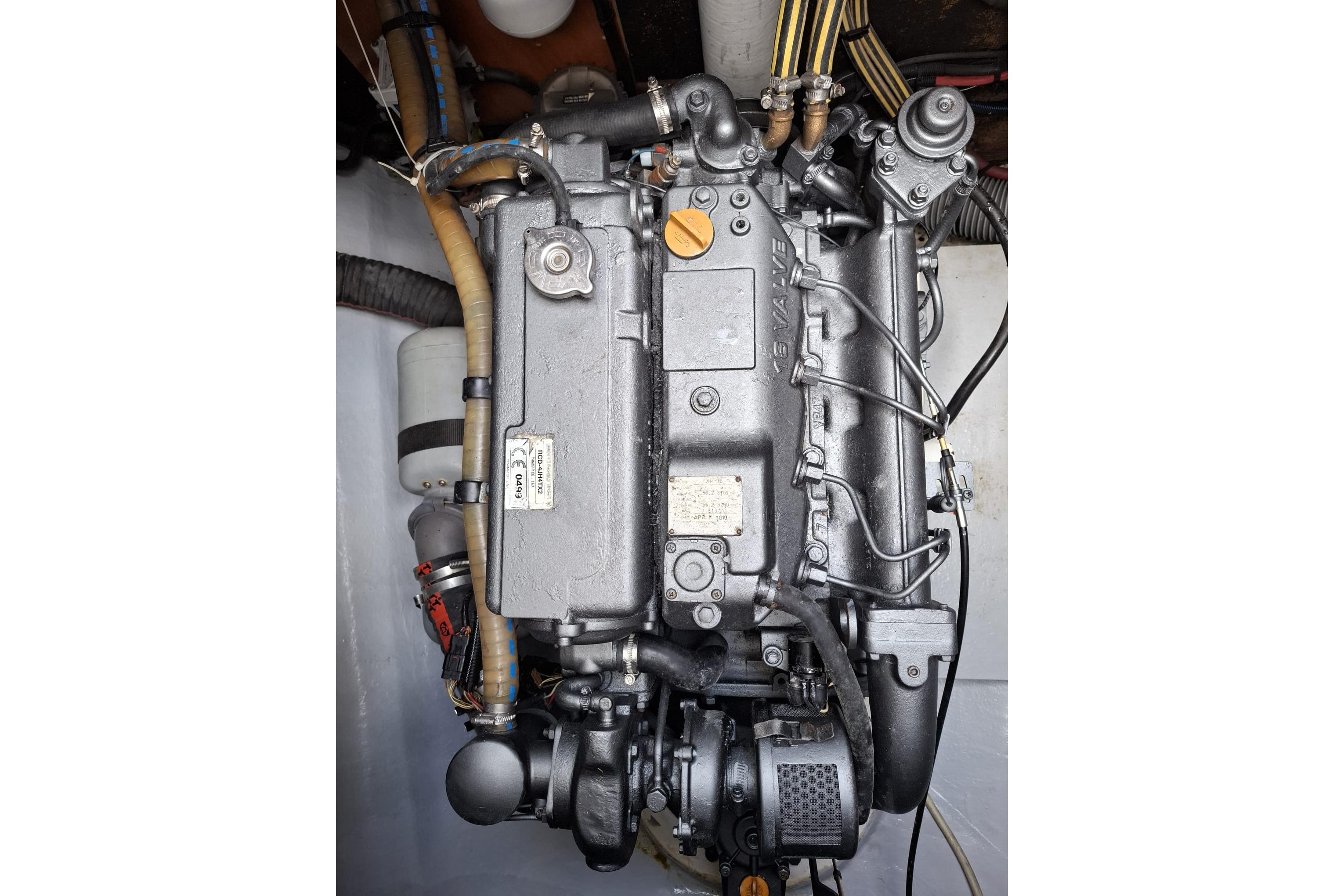 Engine of a 2010 Lagoon 500 catamaran, showcasing intricate mechanical components.