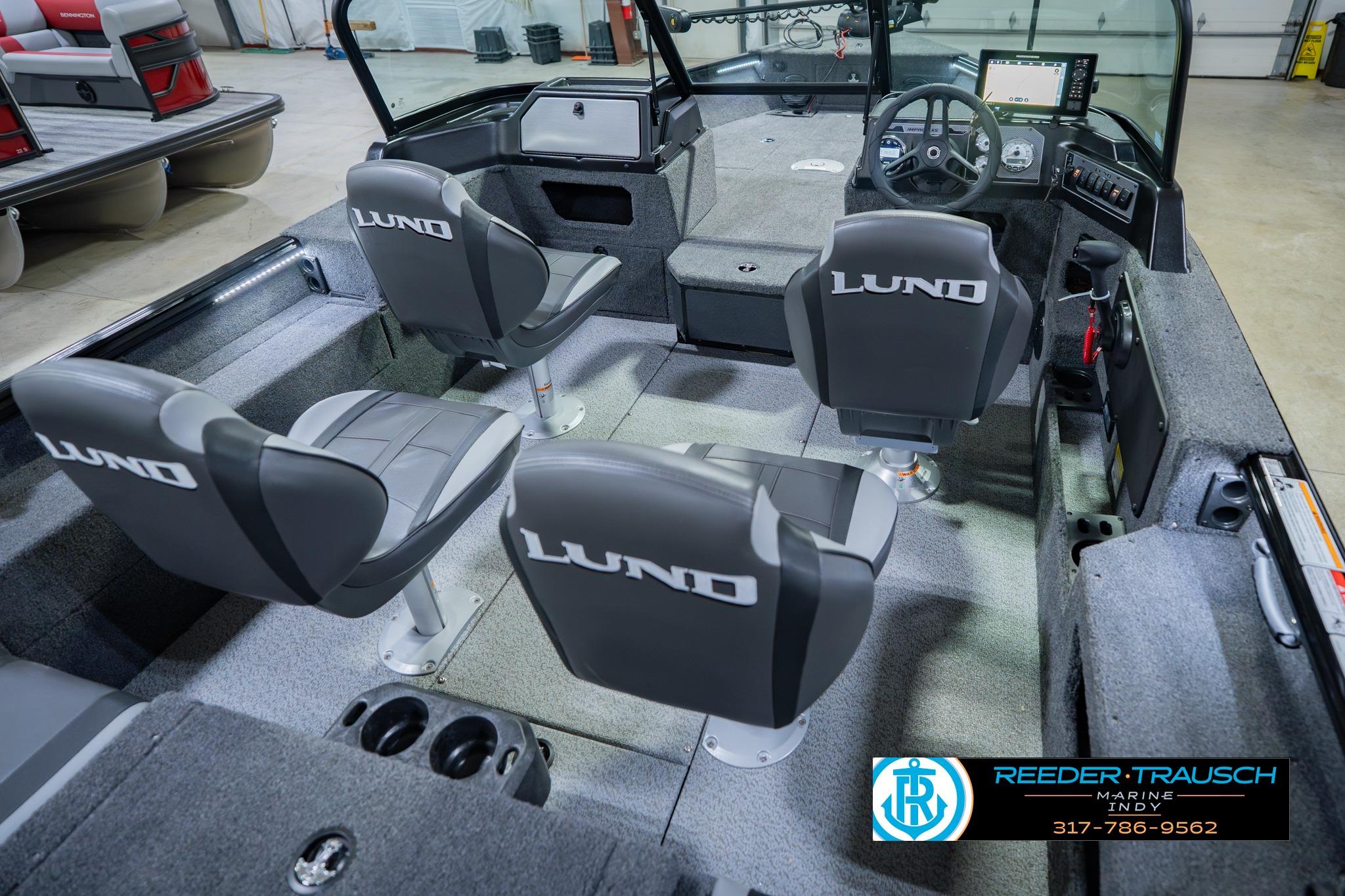 2026 Lund 1775 Impact XS boat interior with four seats and steering console.