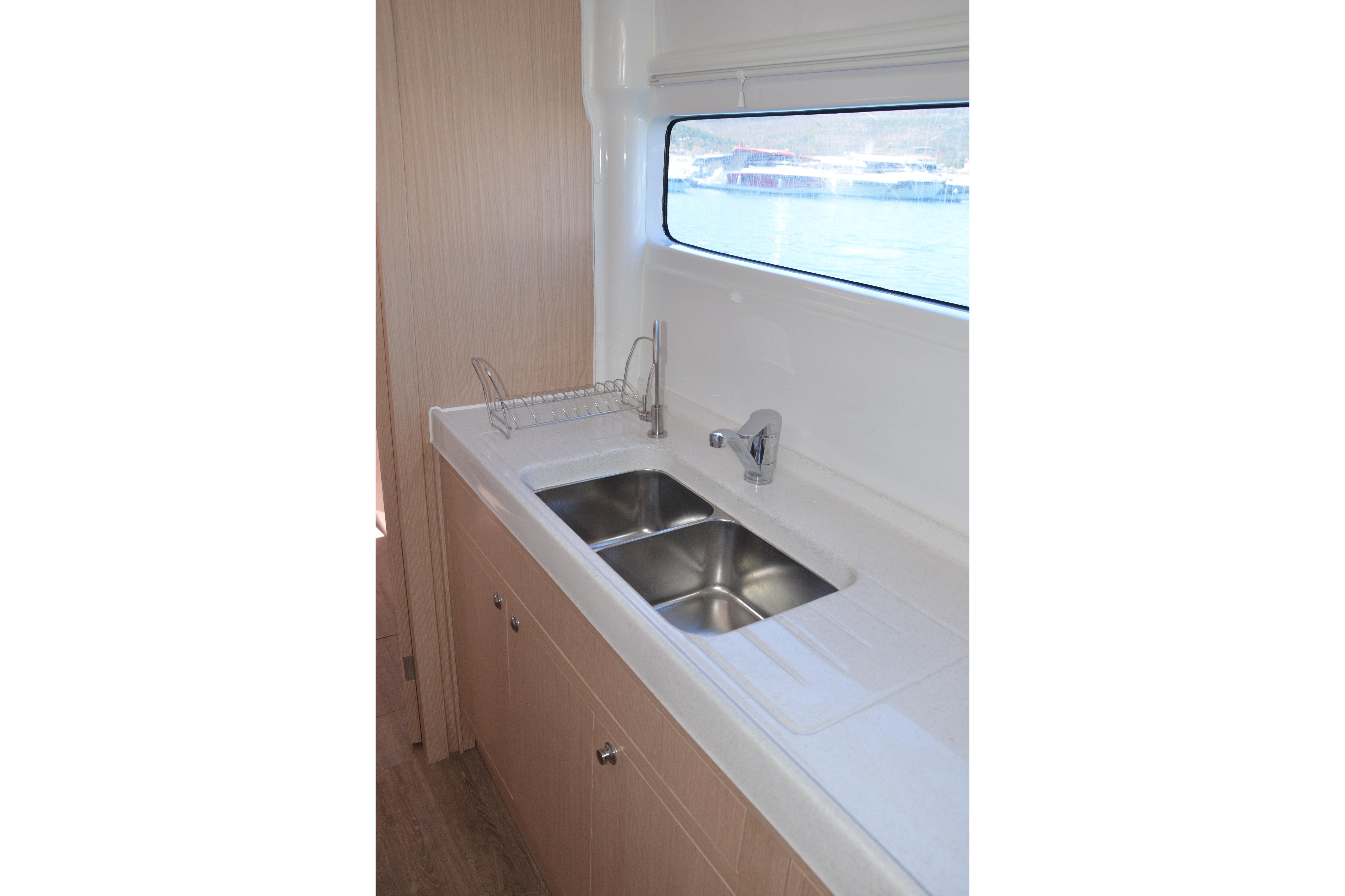 Modern kitchen sink in 2027 Seawind 1170 catamaran, featuring sleek design and ocean view.