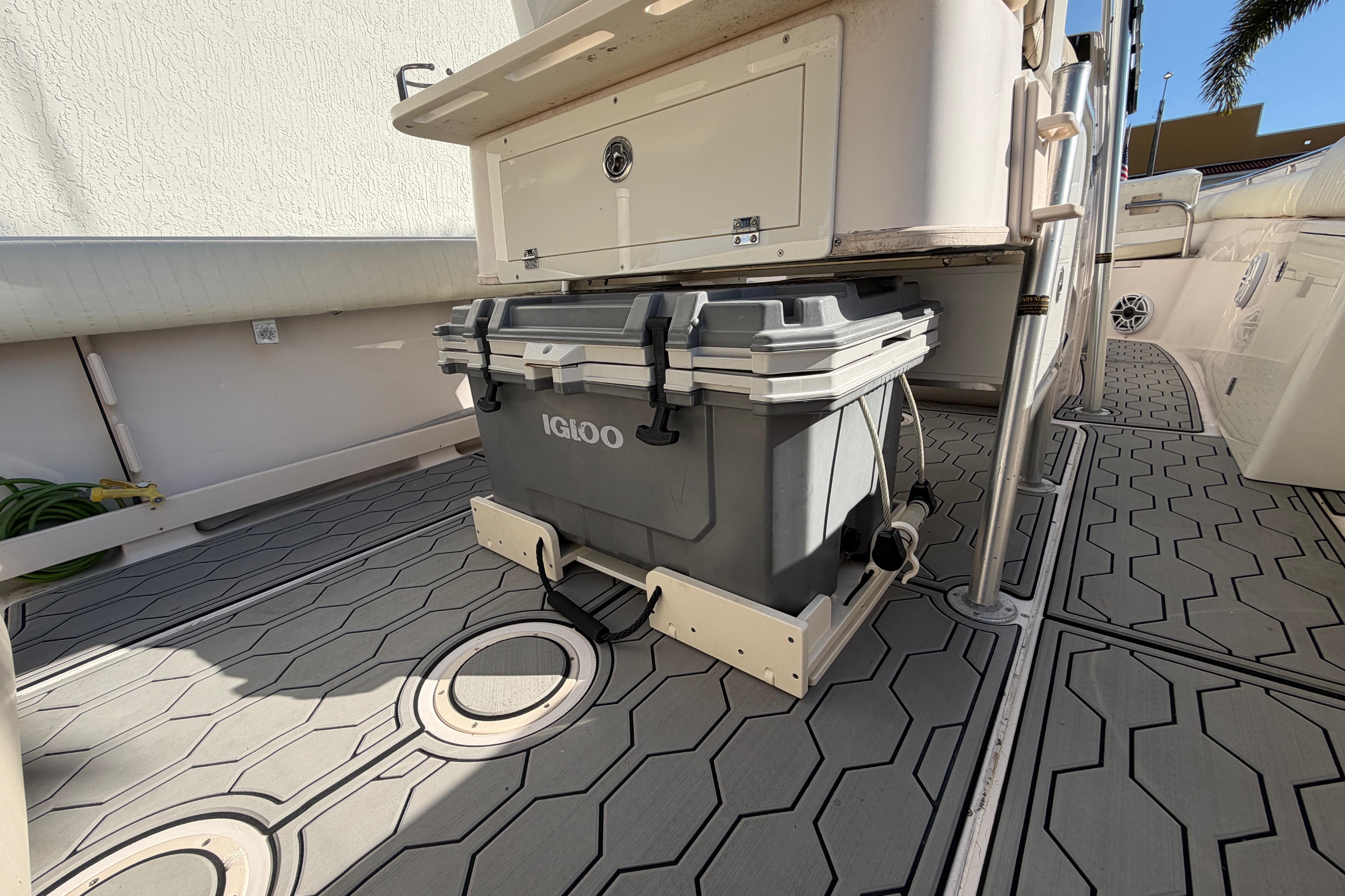 2004 Grady White 273 boat deck with Igloo cooler and storage compartment.