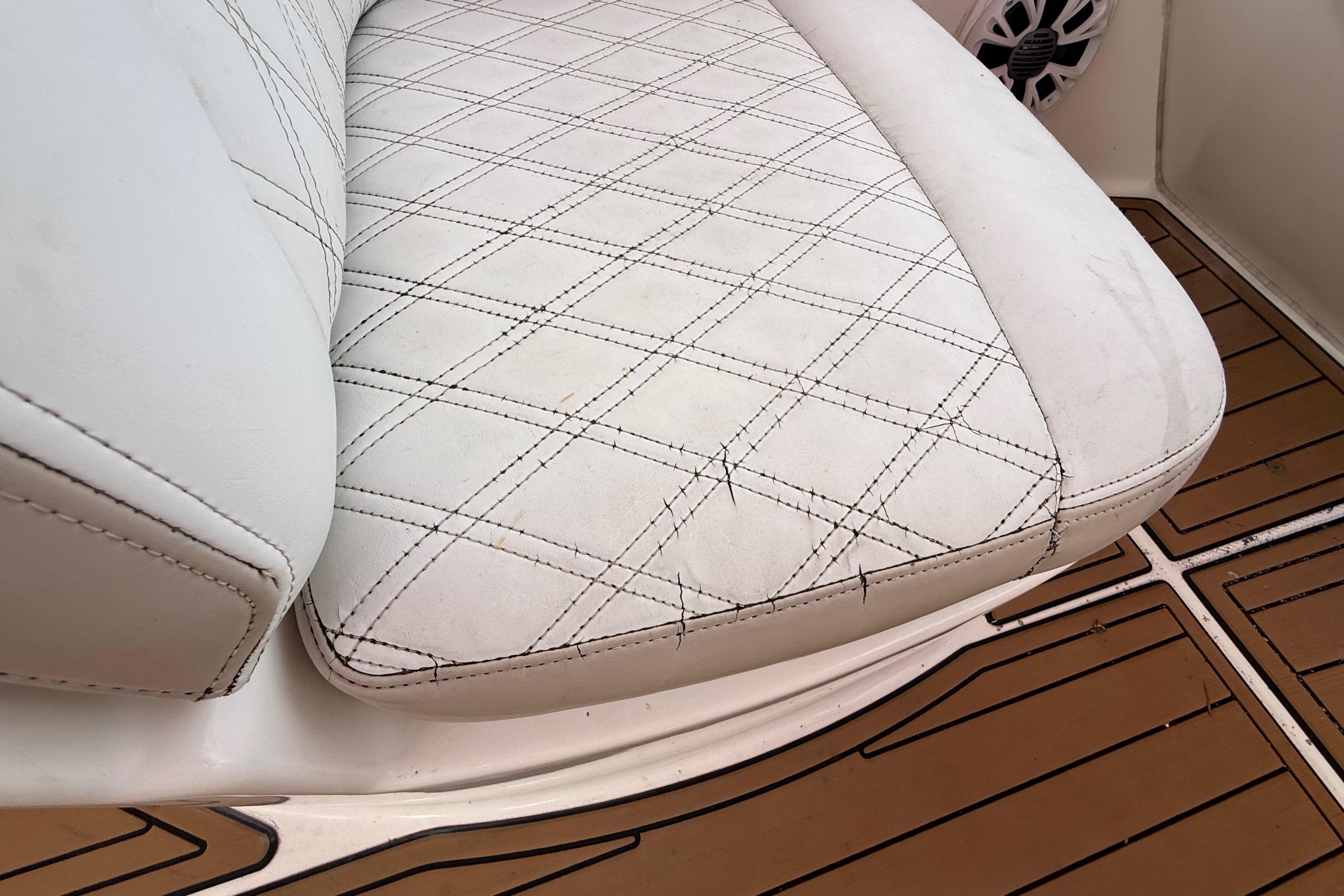 White leather seat with diamond stitching on a 2007 Meridian 459 Motoryacht.