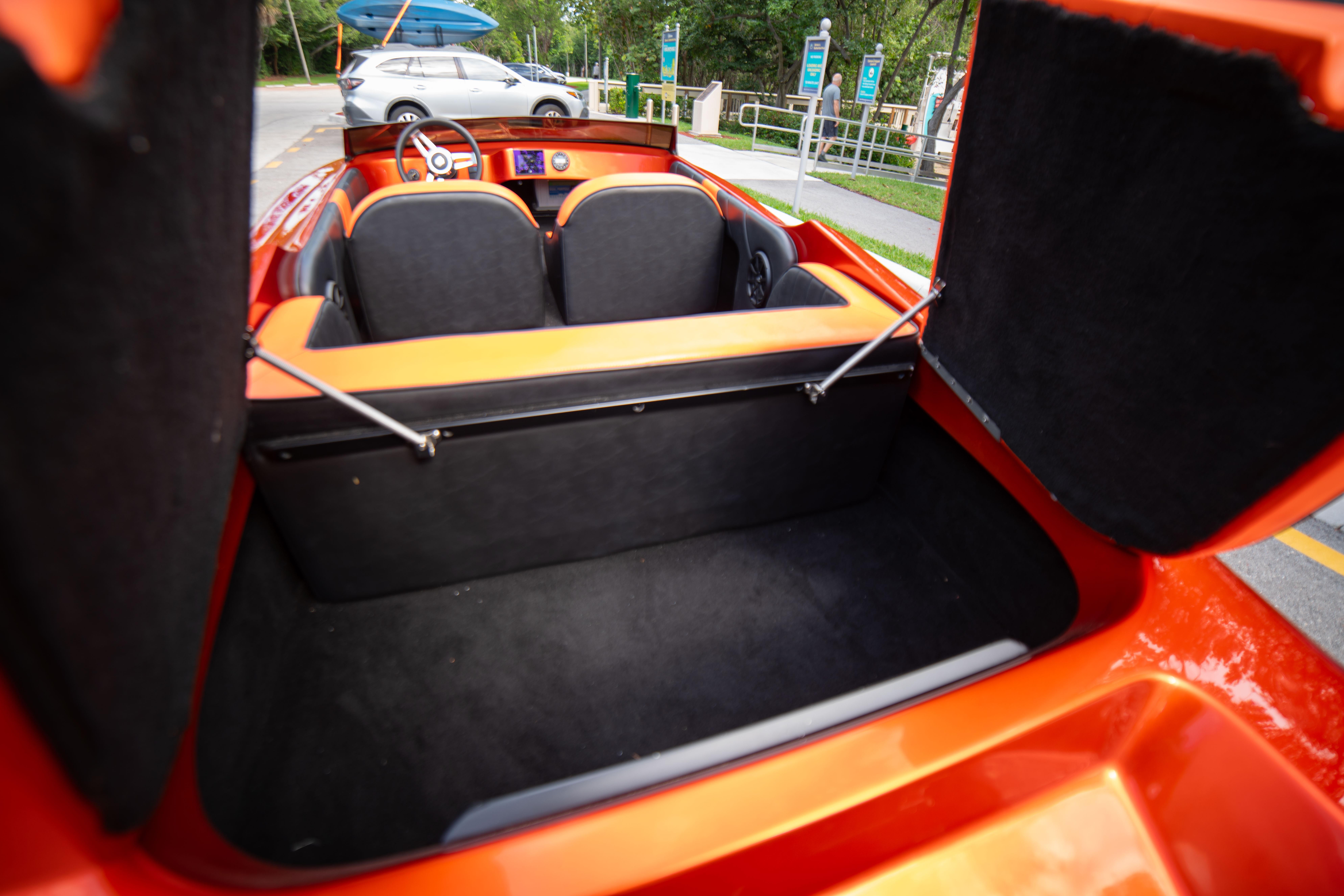 1984 Sleekcraft Aristocrat 20 boat interior with open storage compartment.