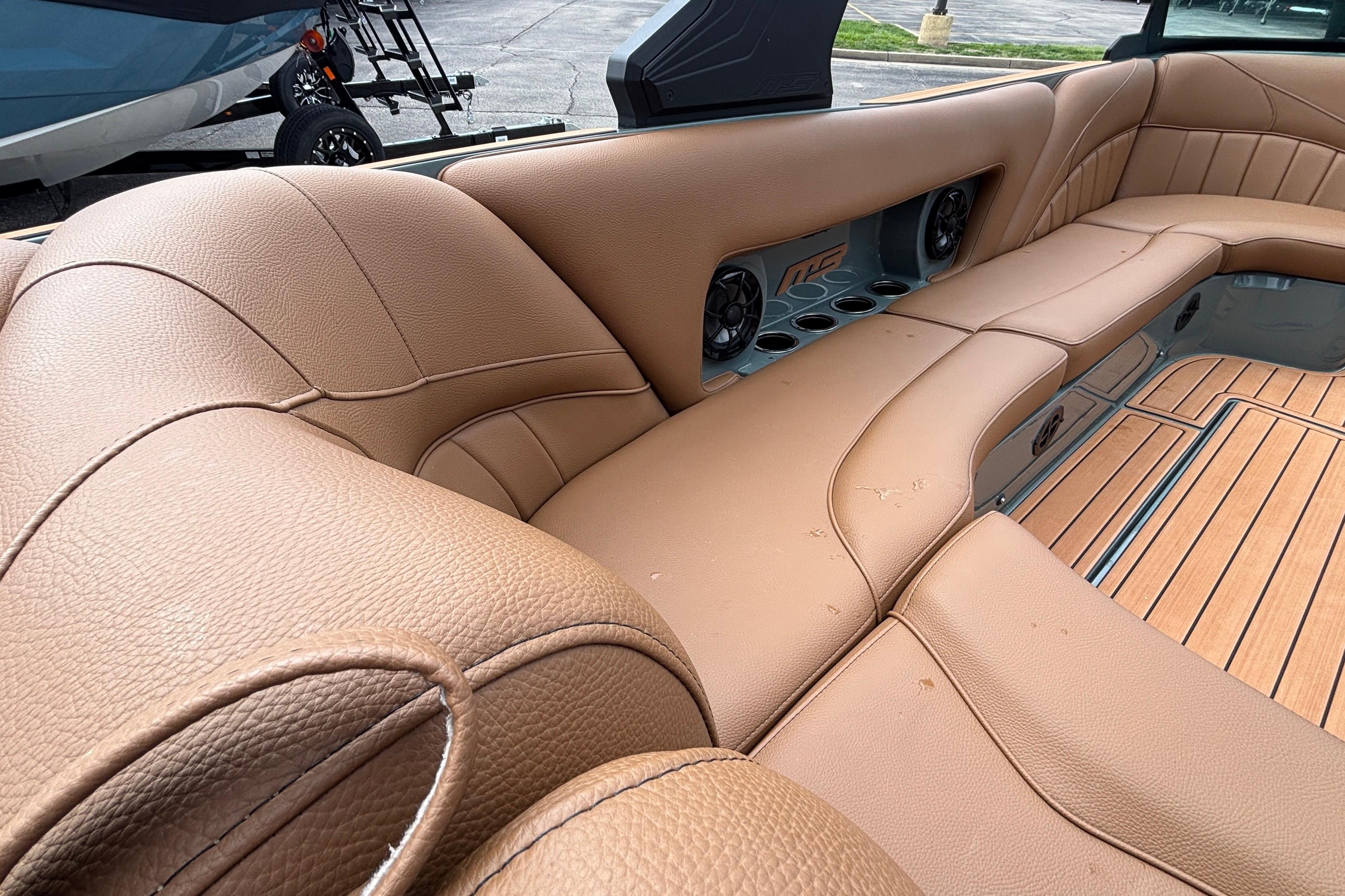 Luxurious tan leather seating in 2026 MB B52 23 Classic boat interior.
