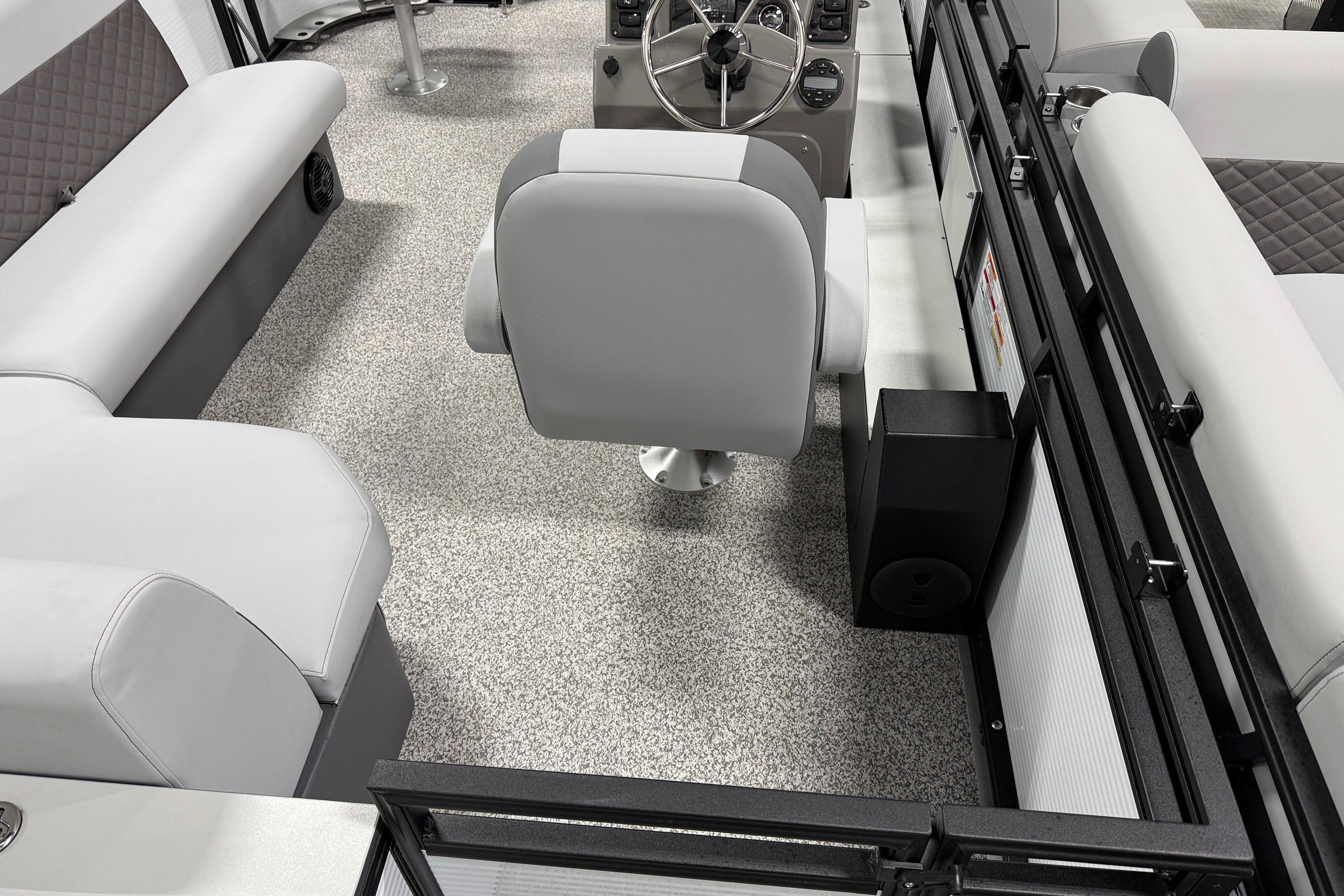 2026 Angler Quest 816 Panfish boat interior with modern seating and steering console.