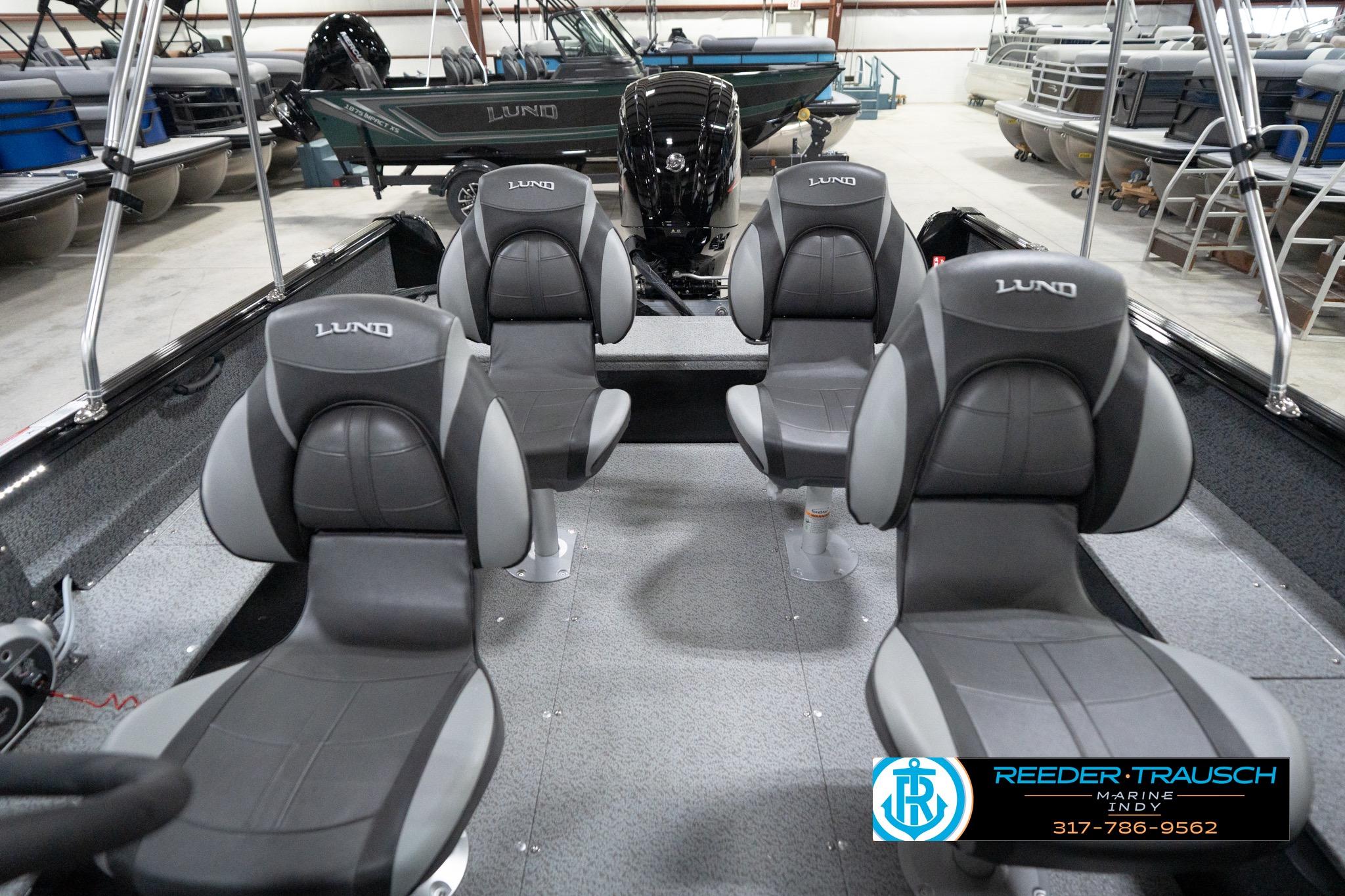2026 Lund 1800 Explorer Sport boat interior with four seats in showroom.
