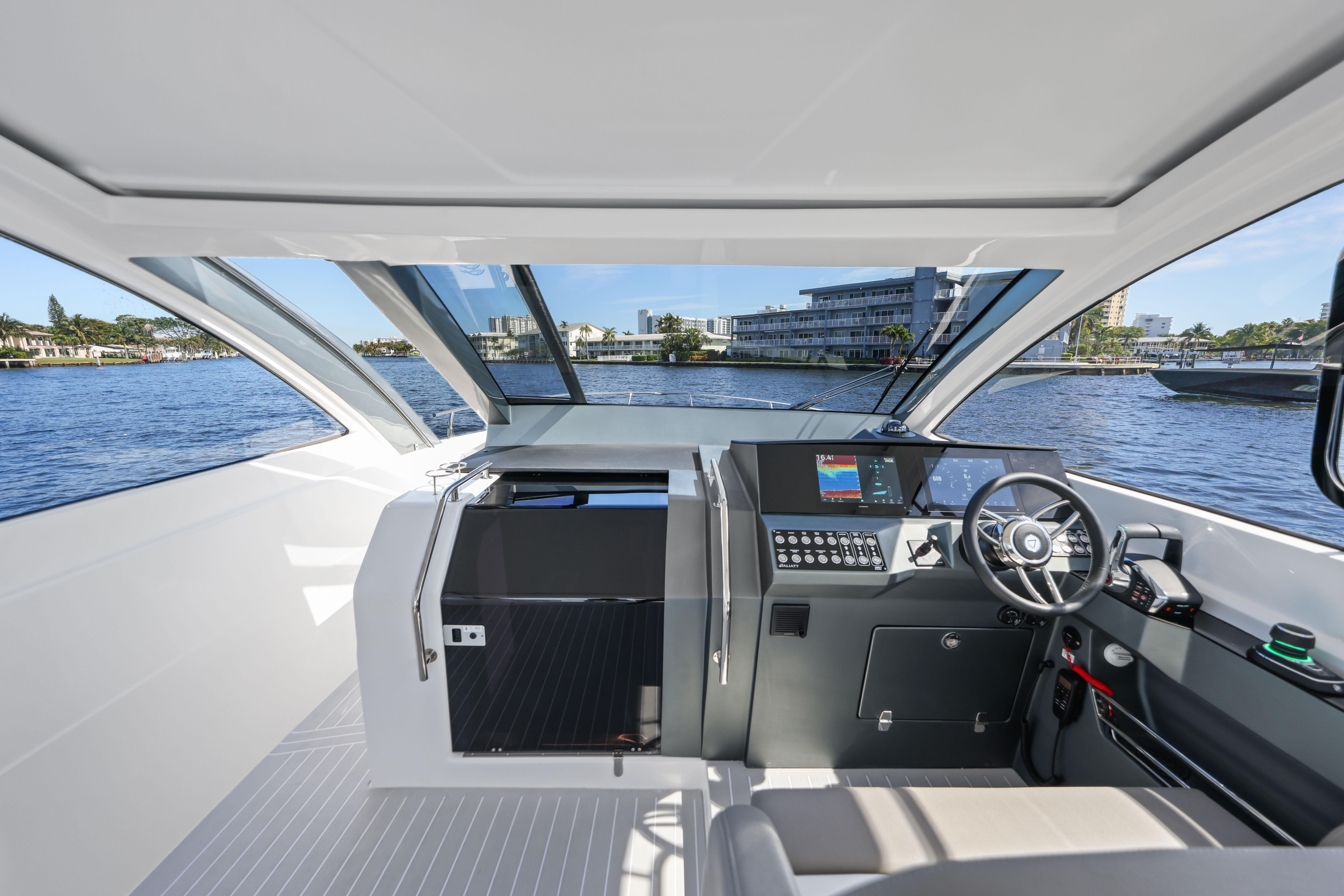 Interior view of 2025 Valiatt 380 Bowrider boat, featuring modern dashboard and steering.