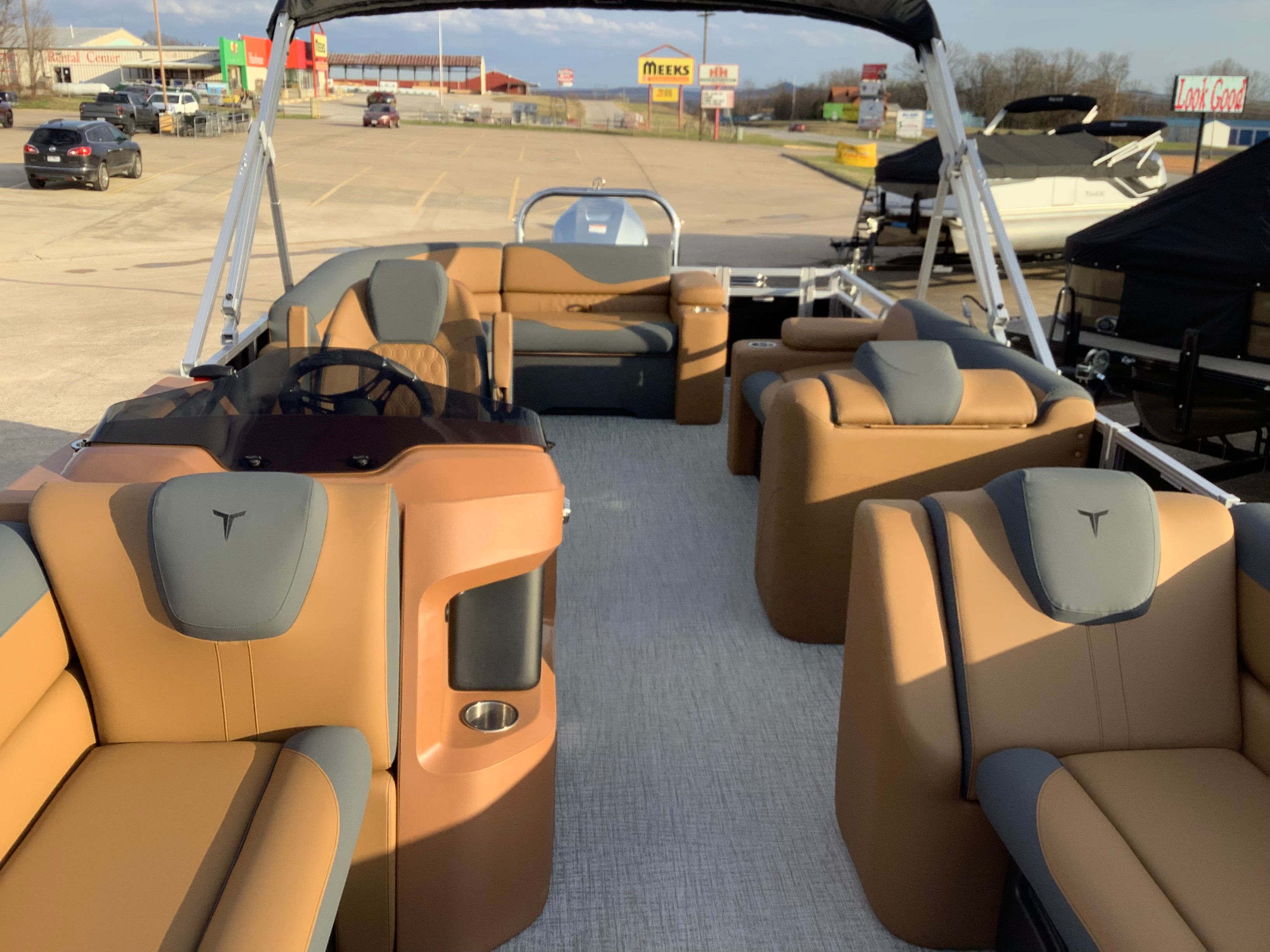 Interior of 2026 Tahoe 2385 LTZ pontoon boat with luxurious seating.
