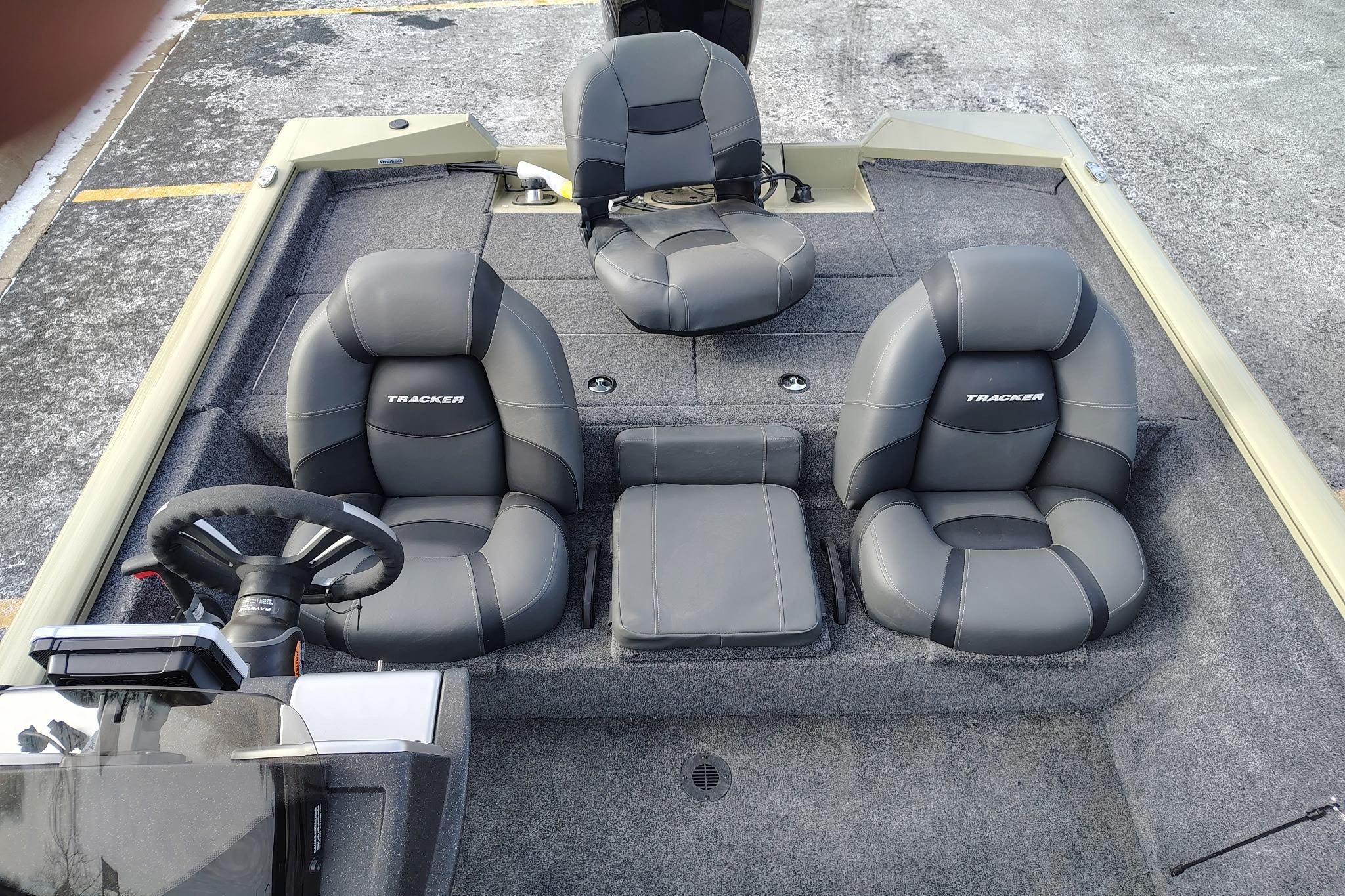 2026 Tracker Pro Team 195 boat interior with gray seating and steering wheel.