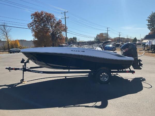 2025 Tahoe T18 boat on trailer in sunny parking lot.