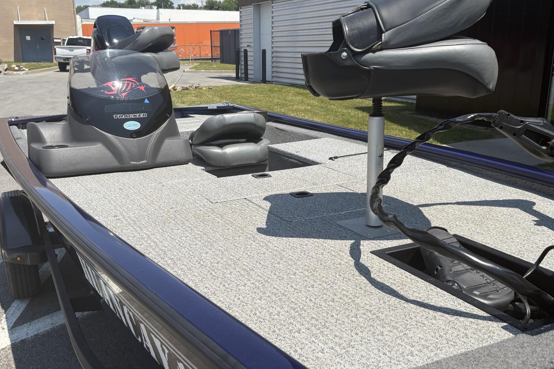 2020 Tracker Pro 170 boat interior with seating and control panel, parked outdoors.