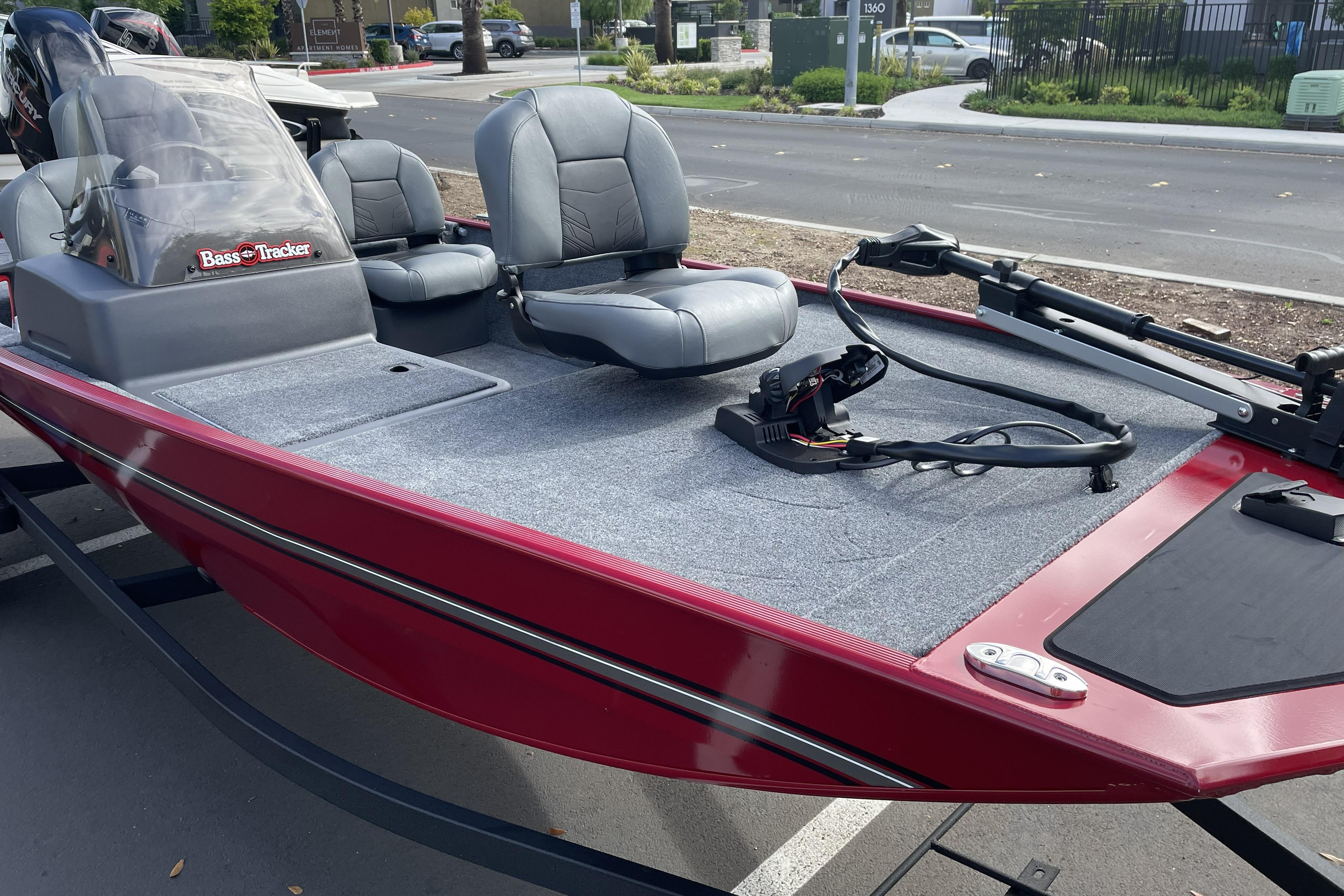 2026 Tracker Bass Tracker Classic XL boat with gray seats and red exterior.