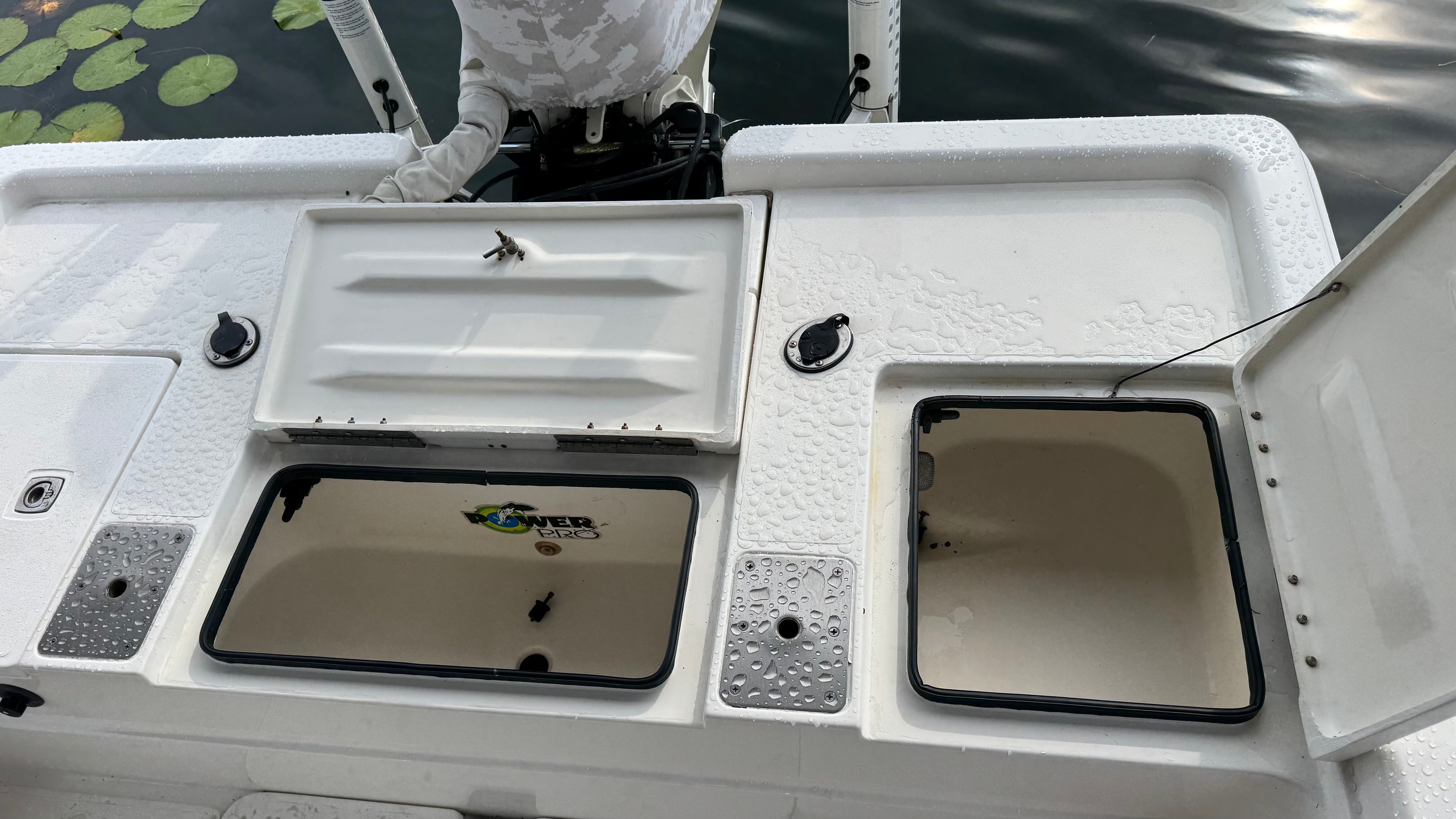 ShearWater LTZ 2004 boat with open storage compartments on deck.
