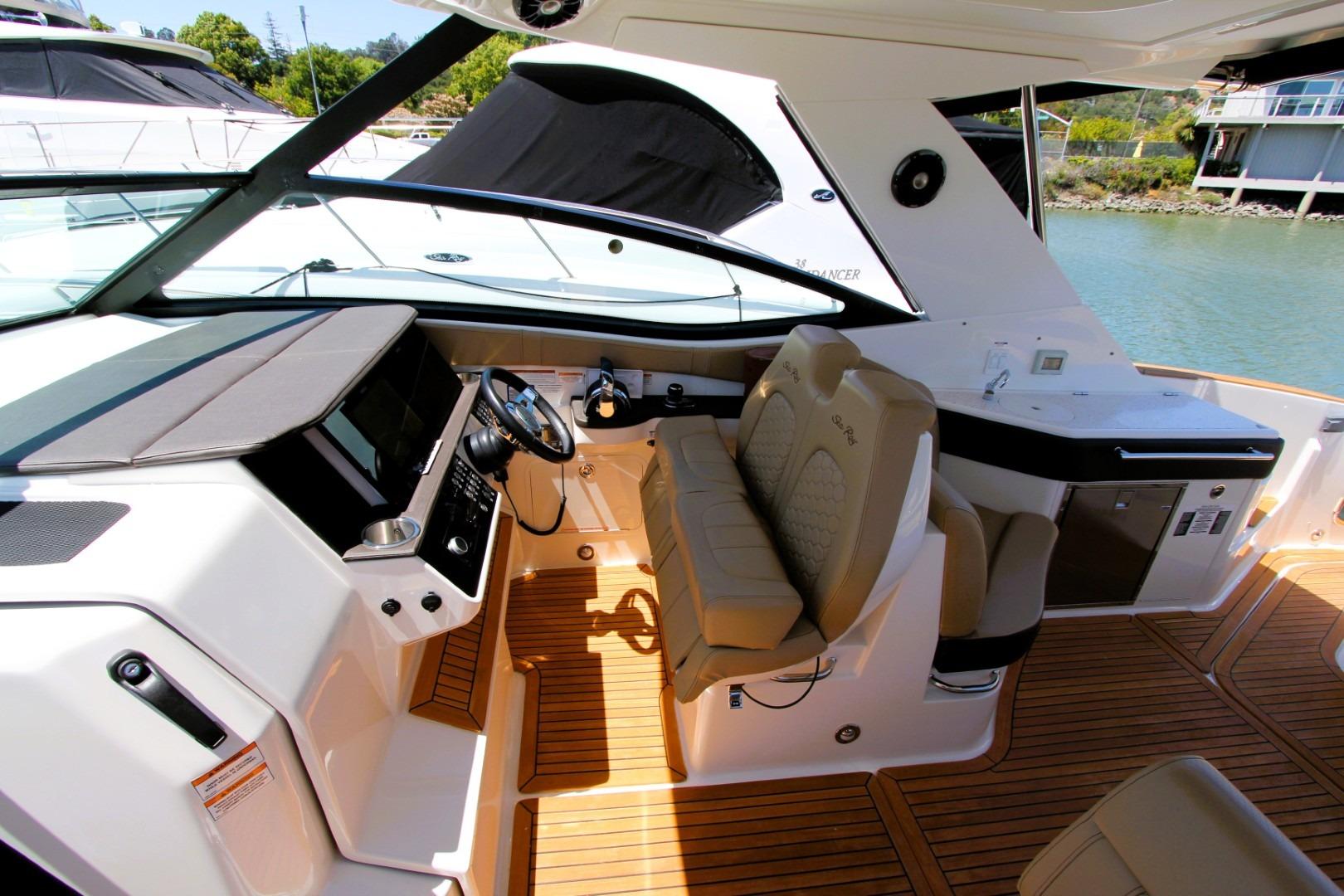 2021 Sea Ray Sundancer 320 Outboard cockpit with luxurious seating and modern controls.