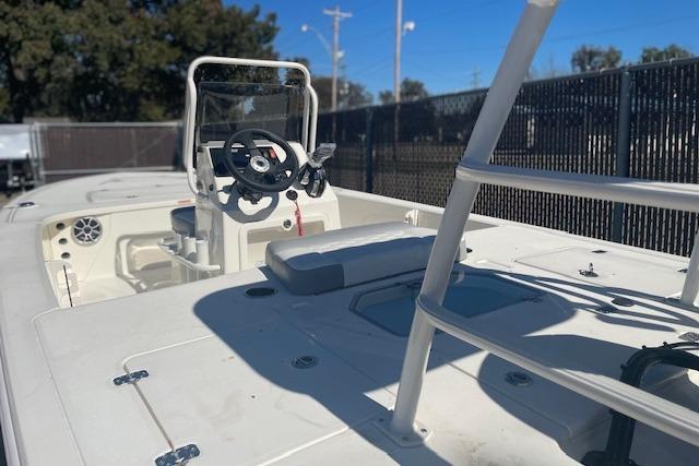 2026 Mako 18 Pro Skiff boat interior with steering console and seating.